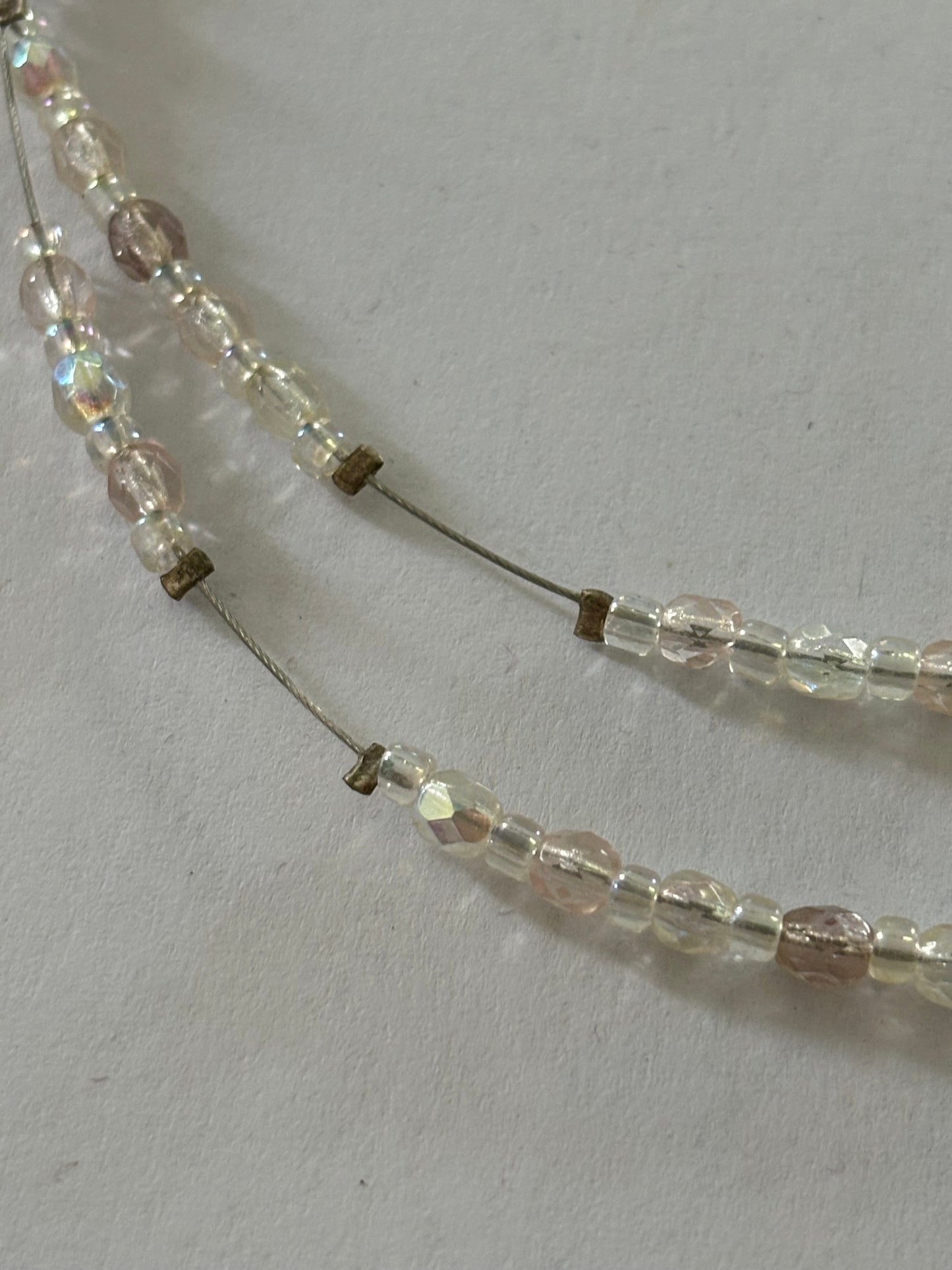 Double silver wire necklace with sliding small clear beads