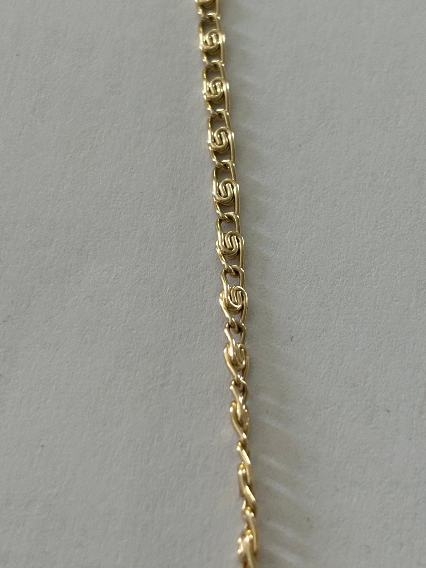 Gold metal chain necklace with V bar pendant of pearlescent beads