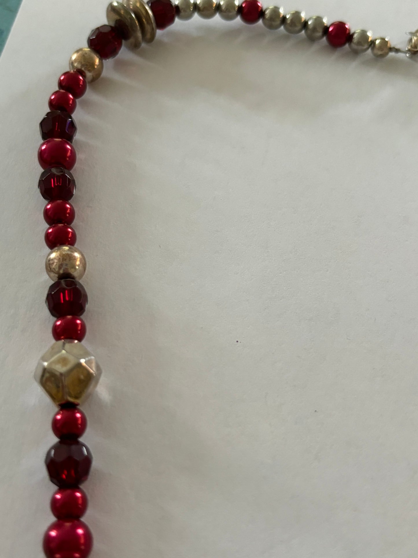 Red, gold and silver bead necklace with silver tassle