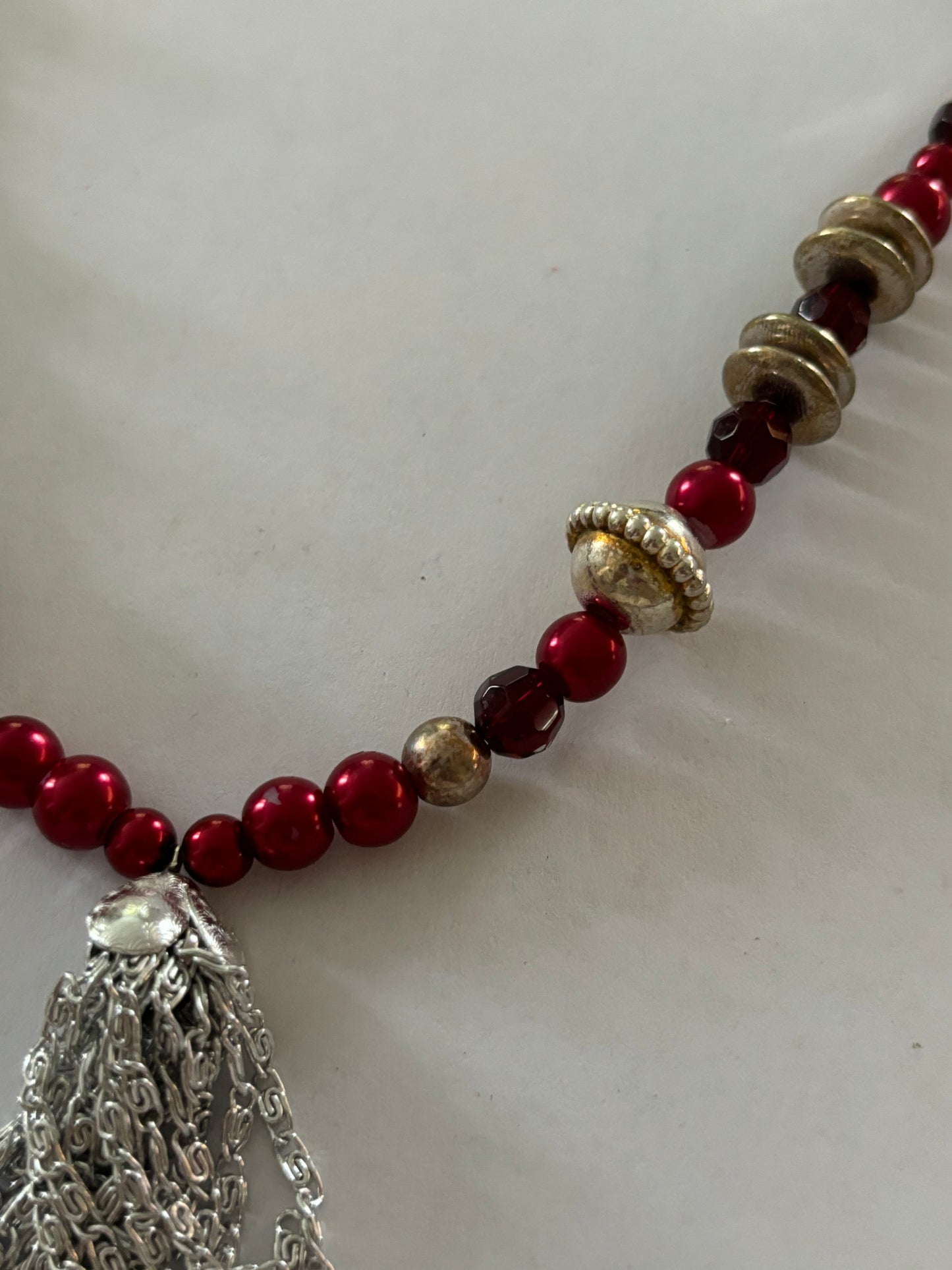 Red, gold and silver bead necklace with silver tassle