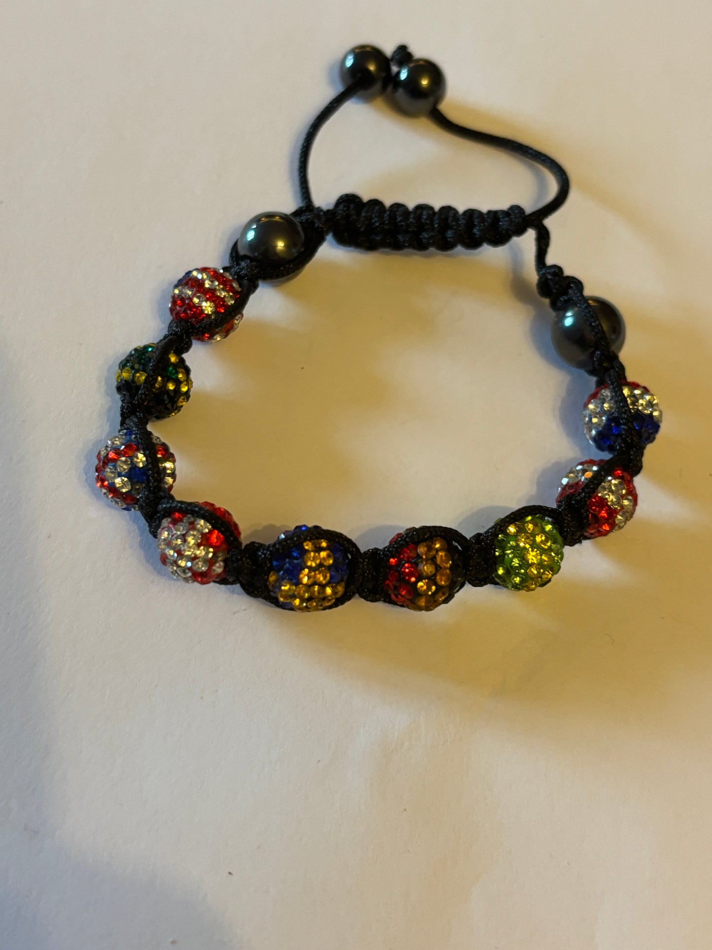 Black friendship bracelet with coloured flag crystal beads