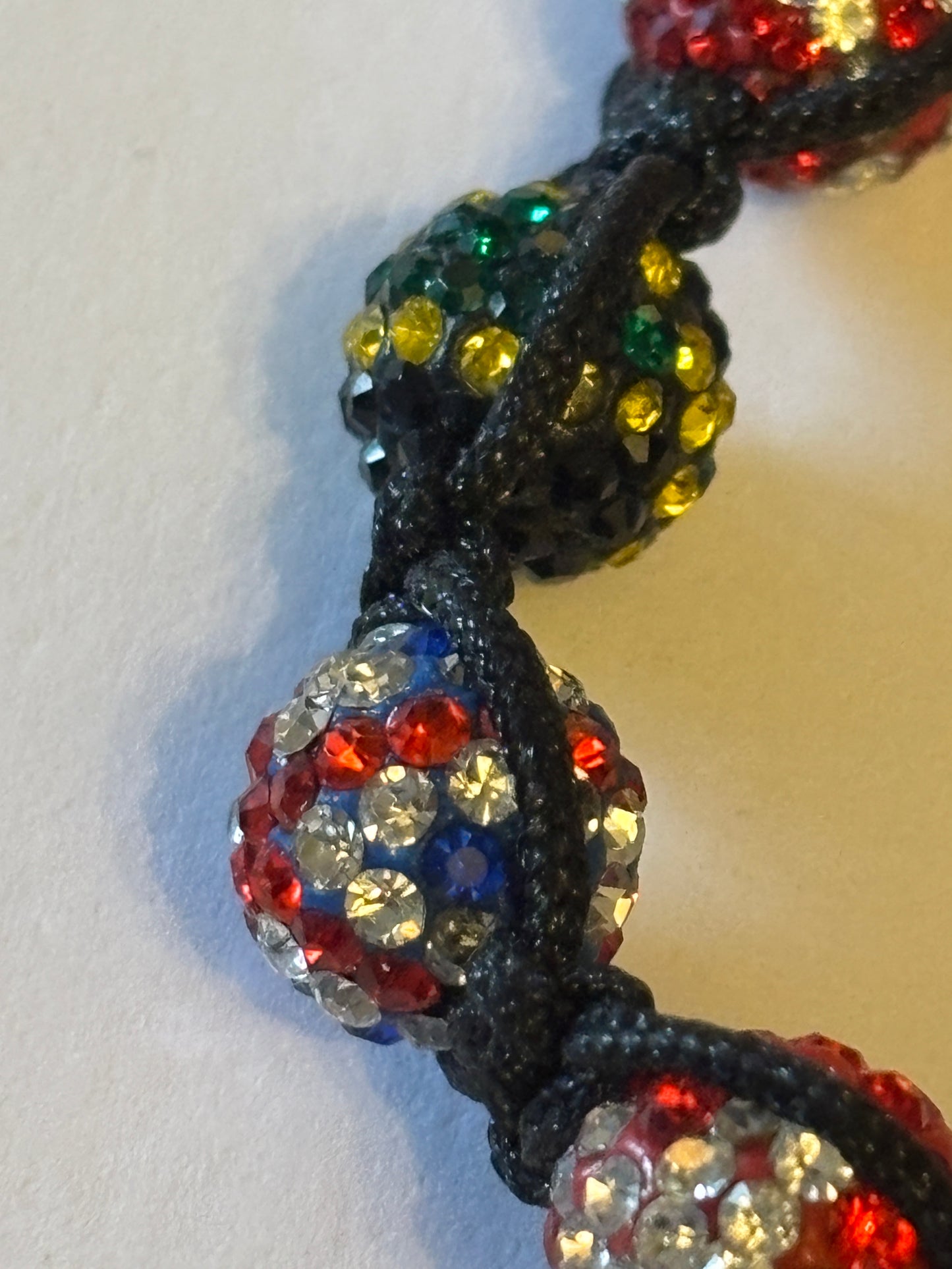 Black friendship bracelet with coloured flag crystal beads