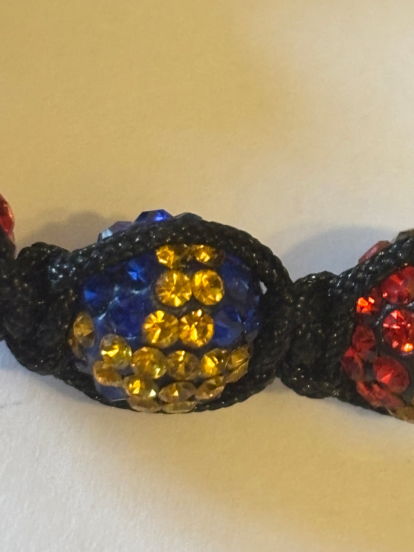 Black friendship bracelet with coloured flag crystal beads