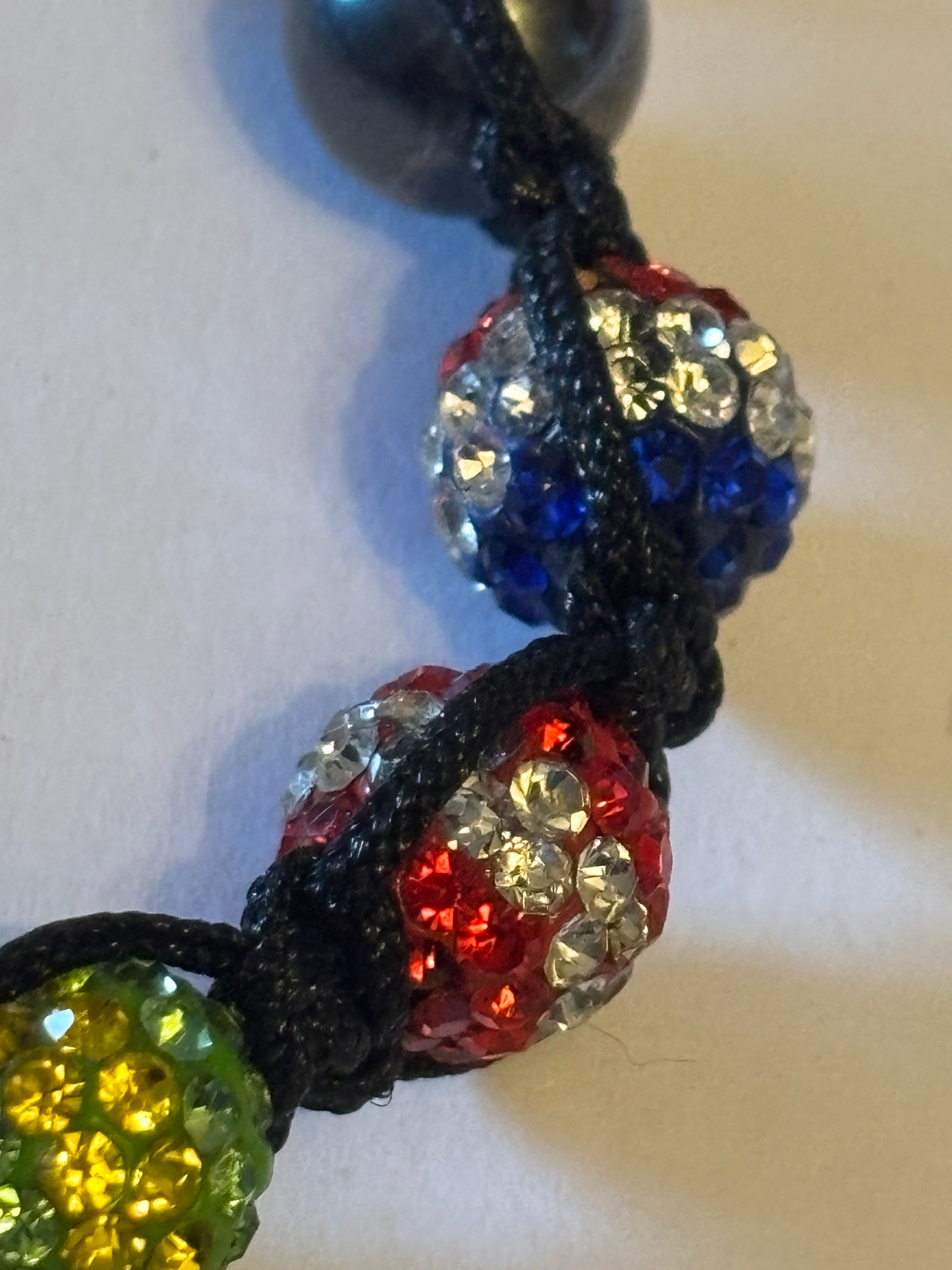 Black friendship bracelet with coloured flag crystal beads