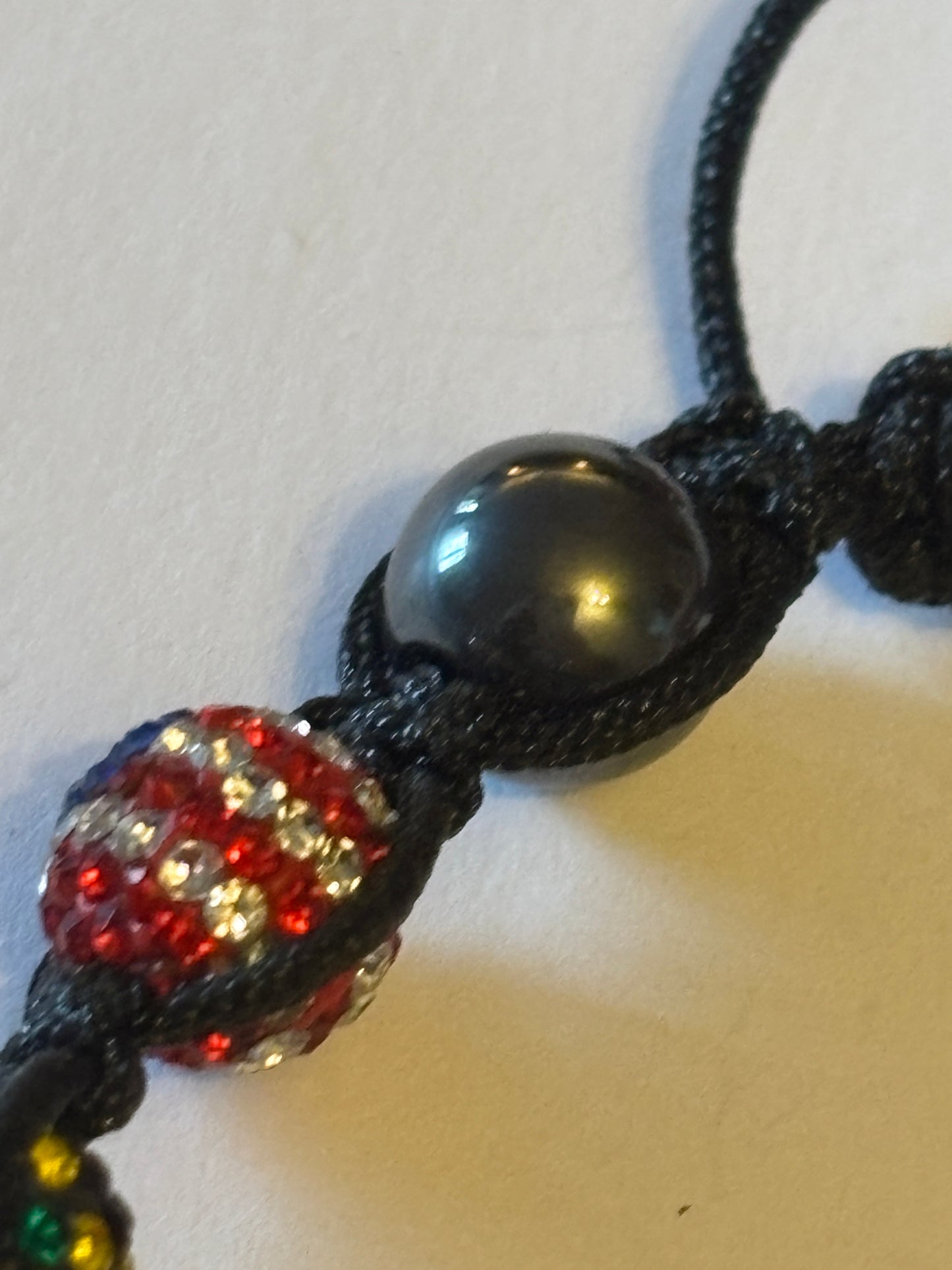 Black friendship bracelet with coloured flag crystal beads