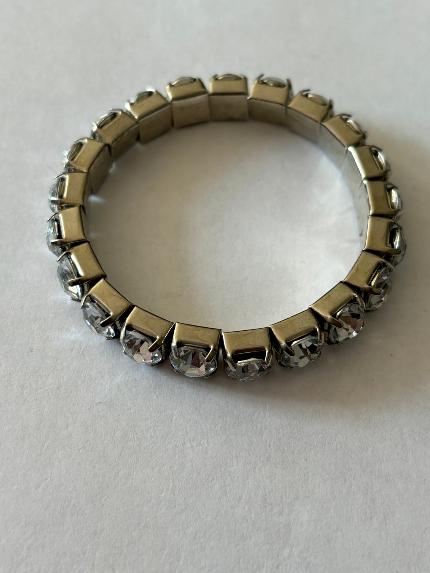 Brass coloured stretch square link bracelet with white stones