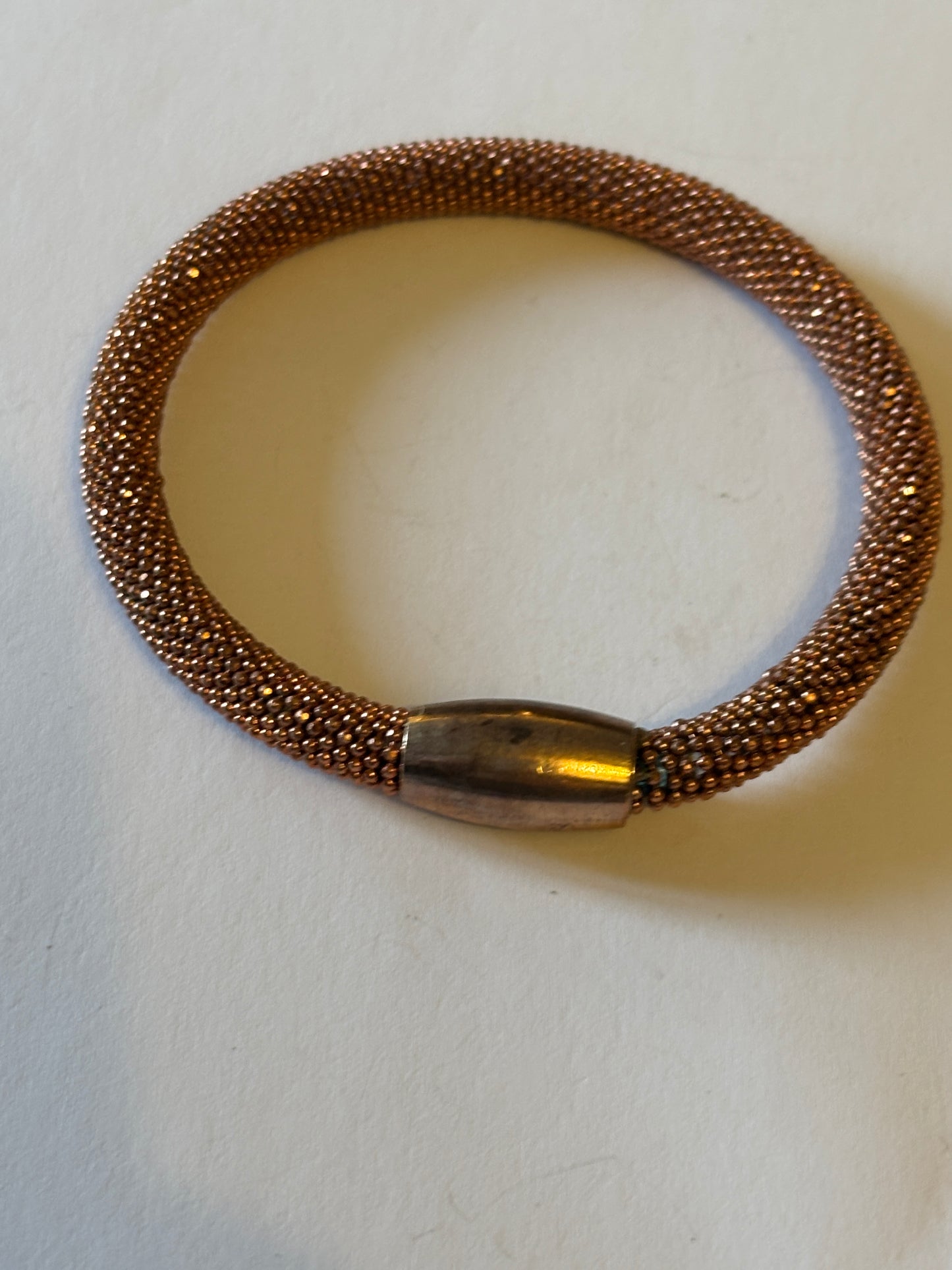 Copper coloured wire mesh tube bangle with magnet clasp