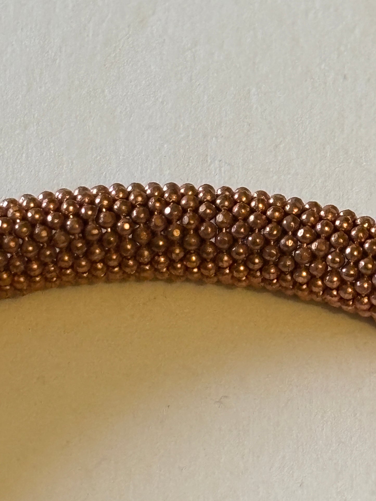 Copper coloured wire mesh tube bangle with magnet clasp