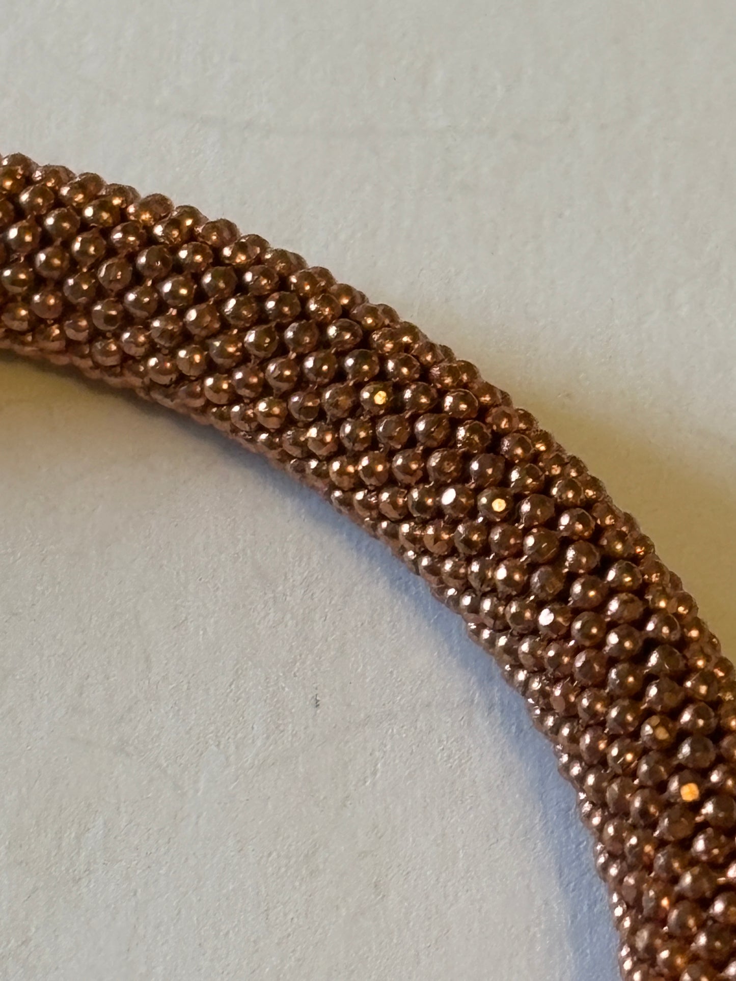 Copper coloured wire mesh tube bangle with magnet clasp