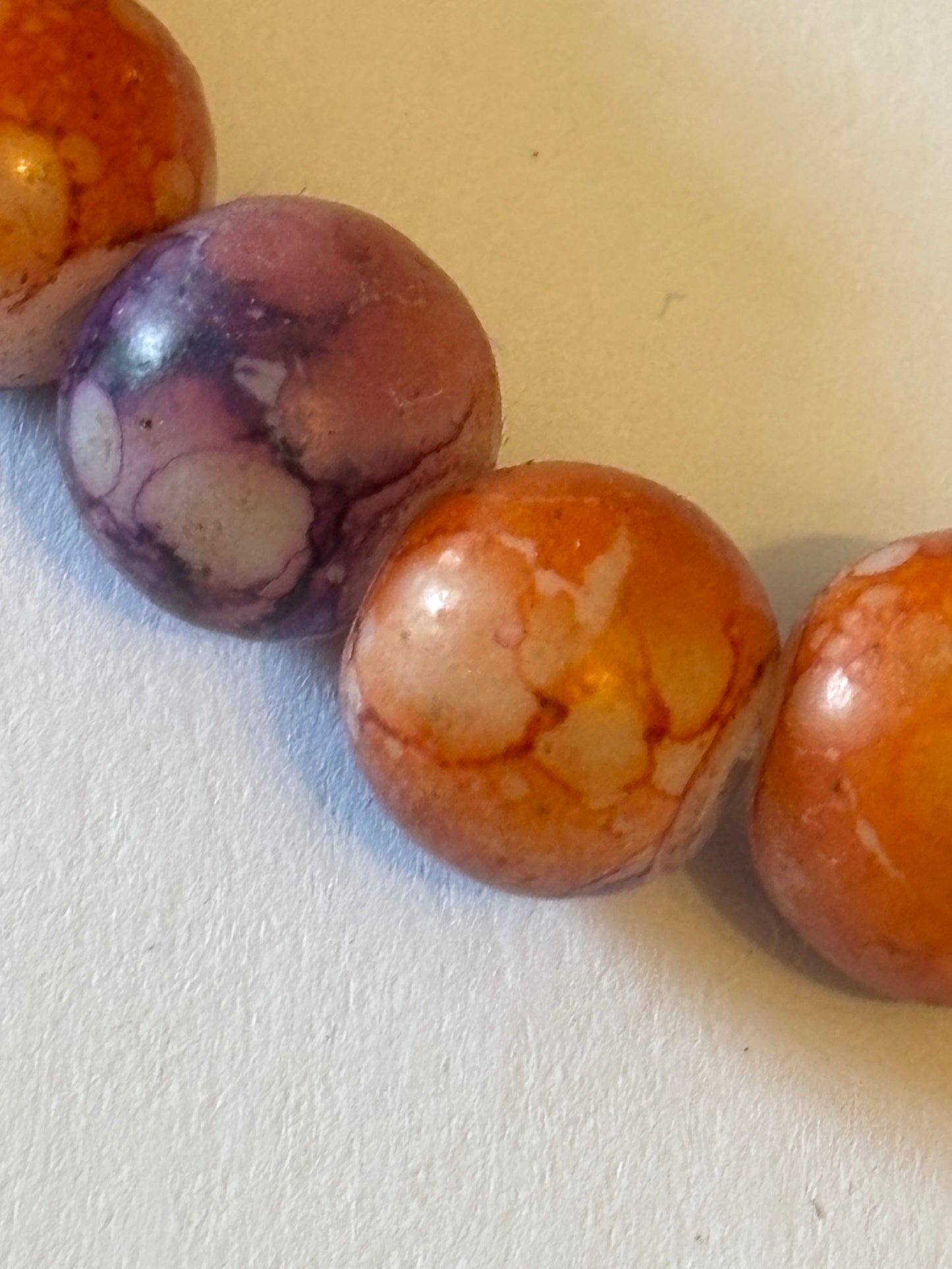 Marbled orange and purple round bead bracelet