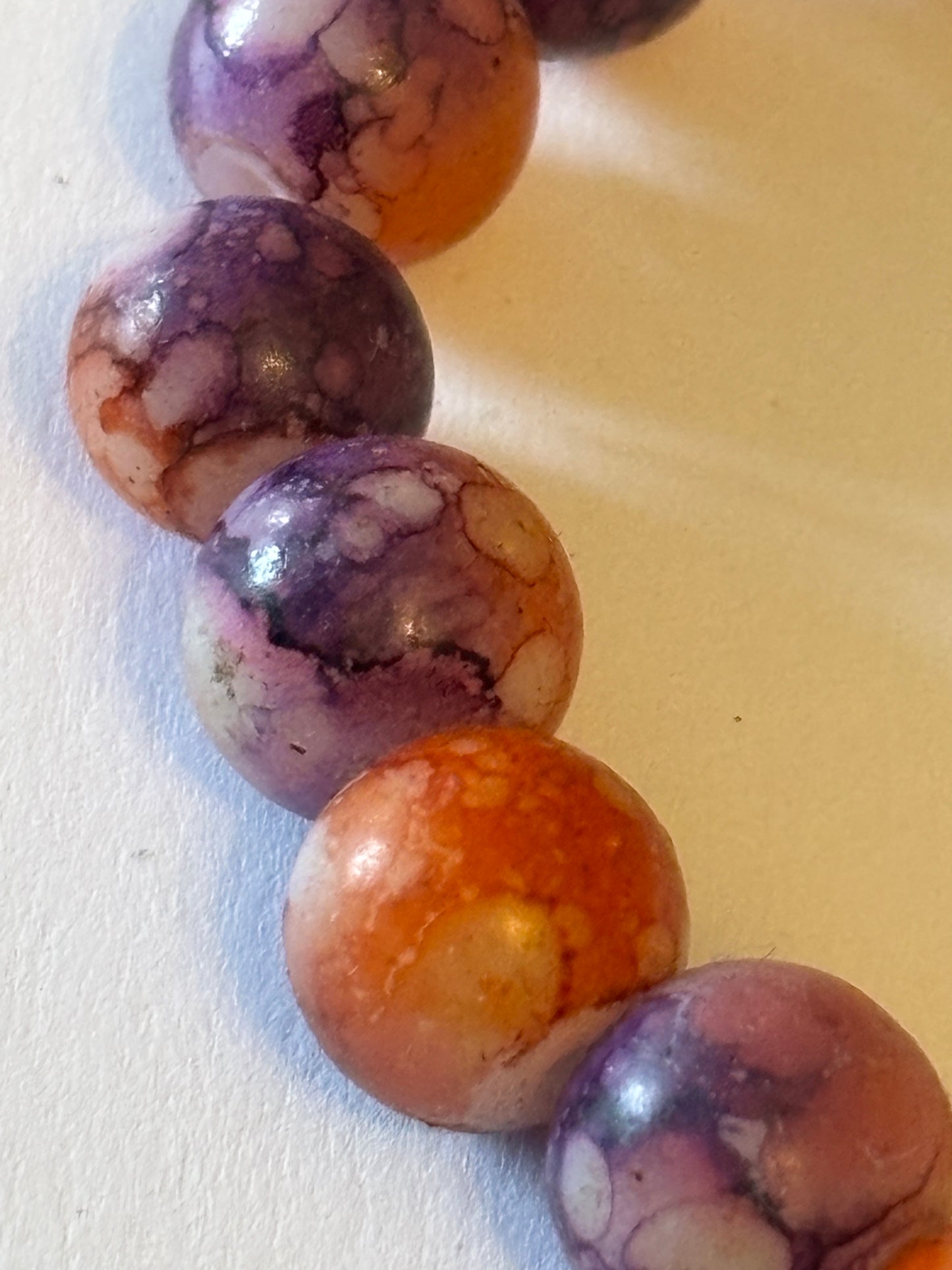 Marbled orange and purple round bead bracelet