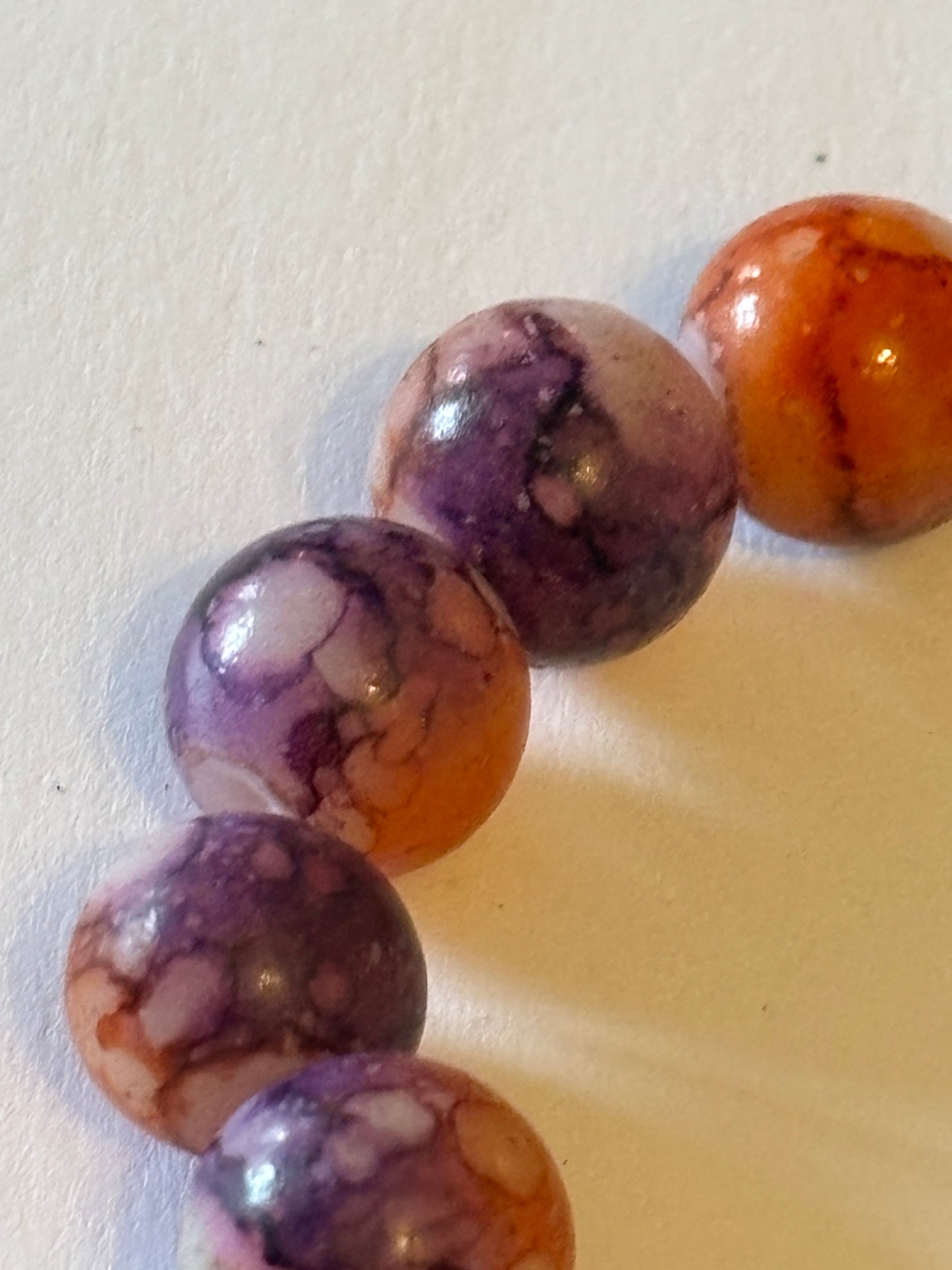 Marbled orange and purple round bead bracelet