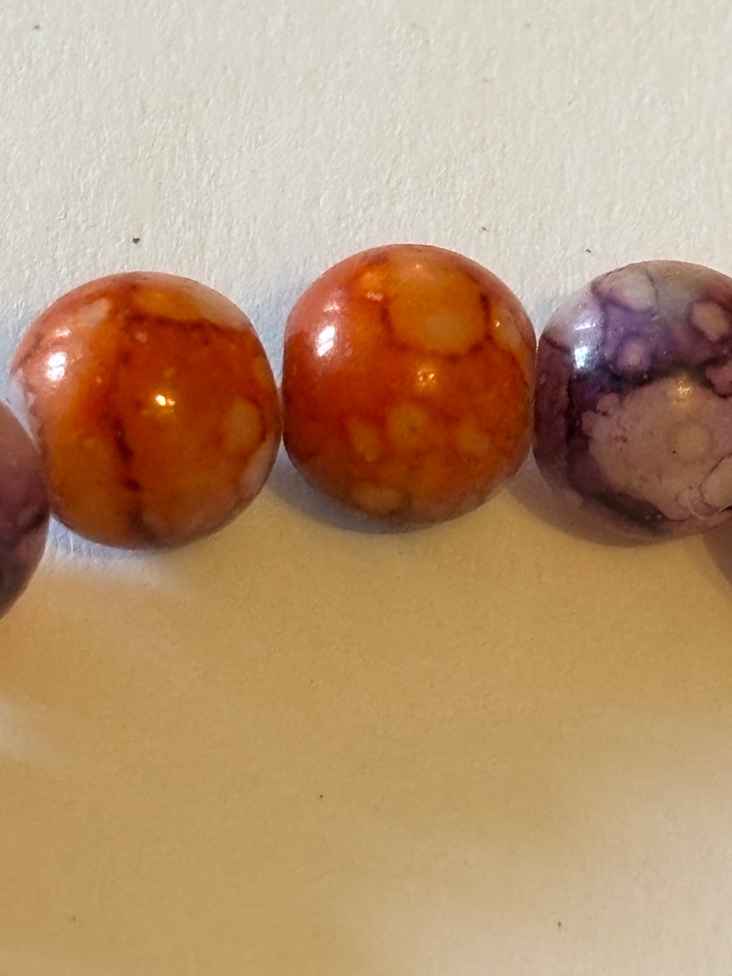 Marbled orange and purple round bead bracelet