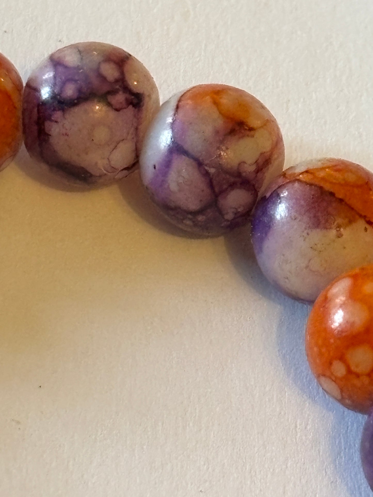 Marbled orange and purple round bead bracelet