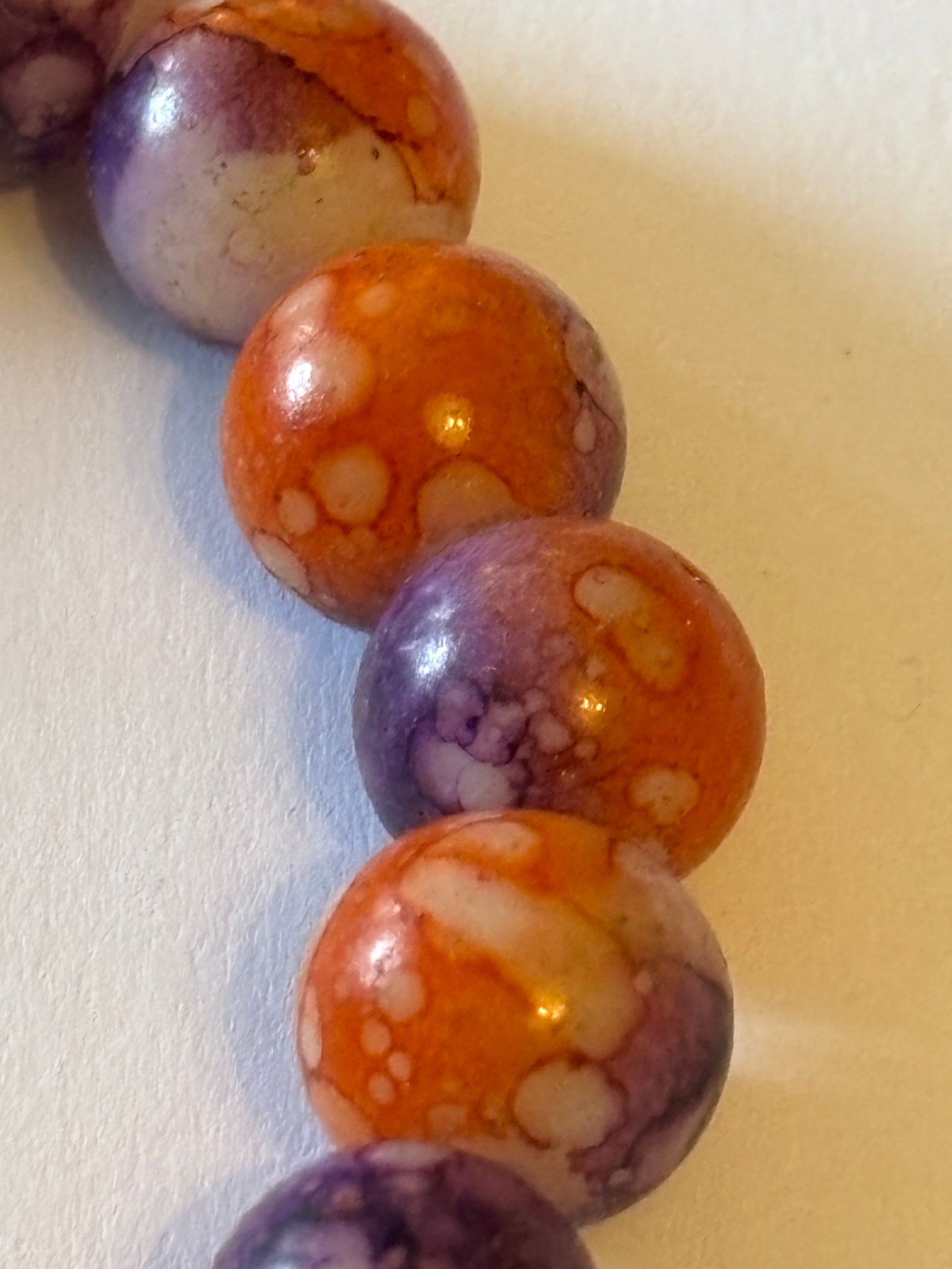 Marbled orange and purple round bead bracelet