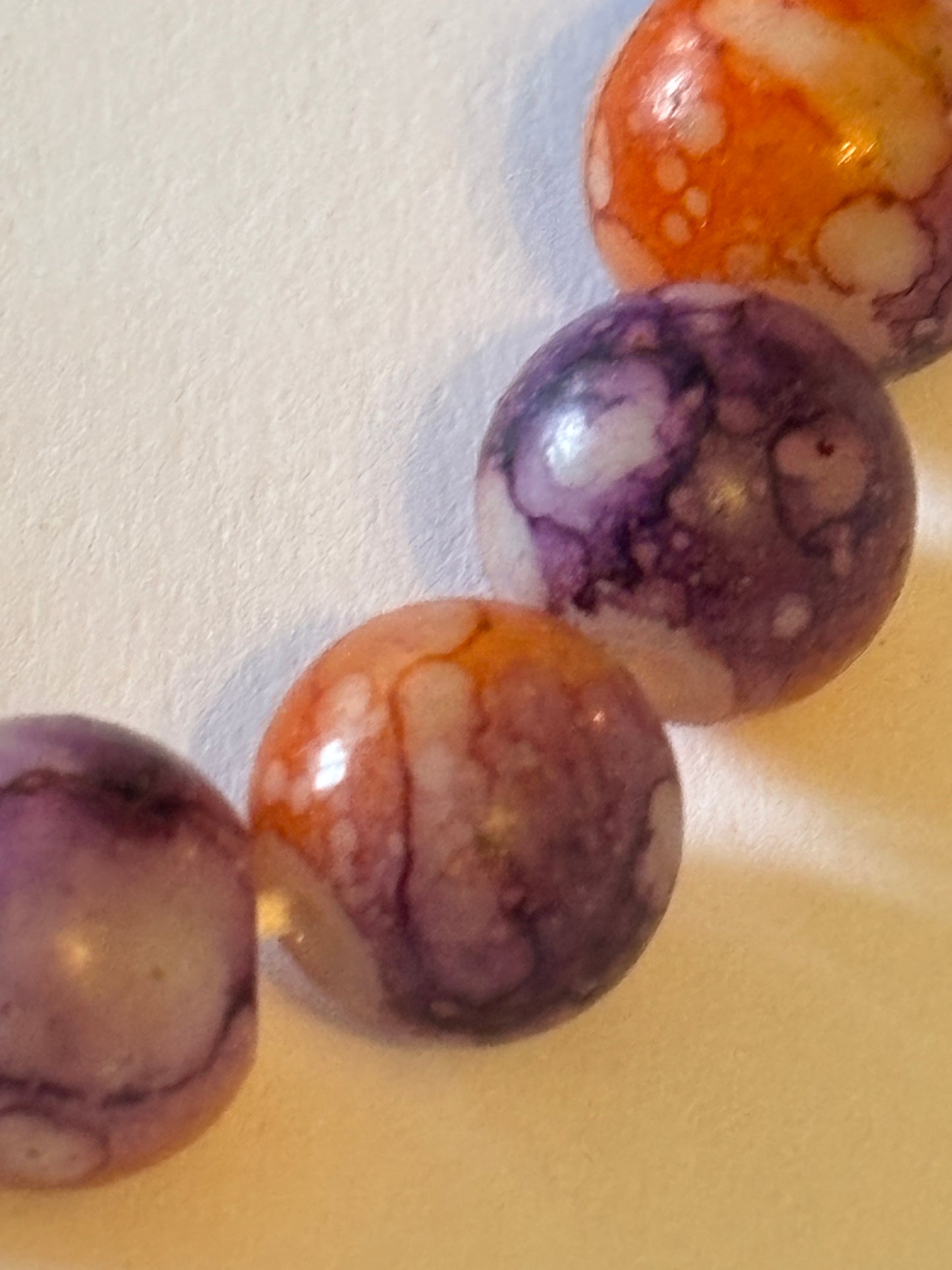 Marbled orange and purple round bead bracelet