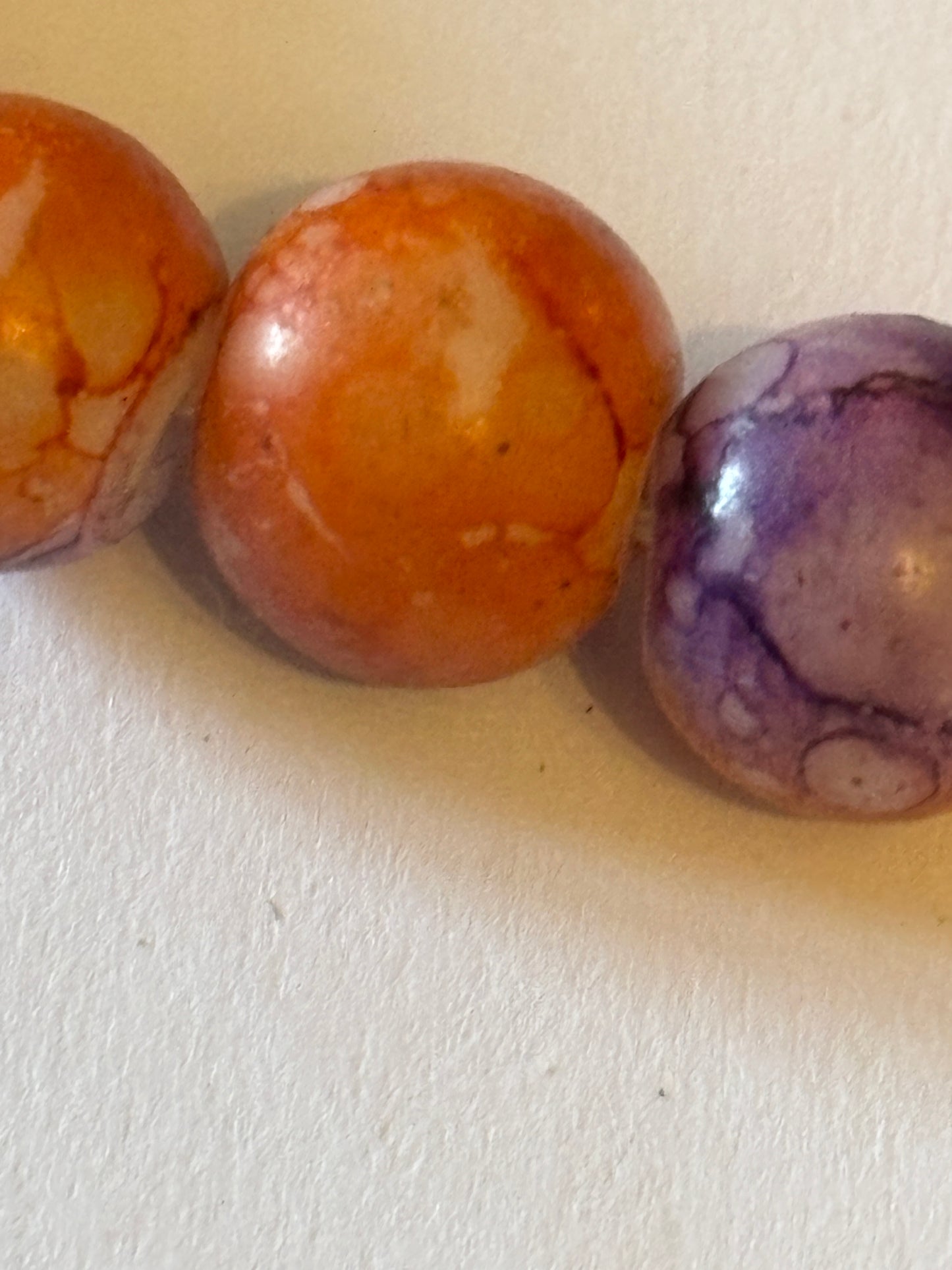 Marbled orange and purple round bead bracelet