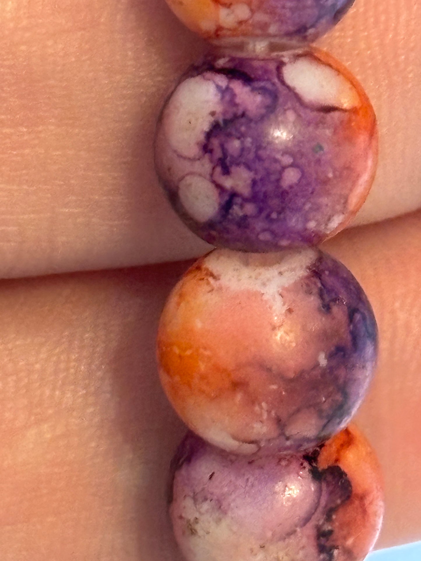 Marbled orange and purple round bead bracelet