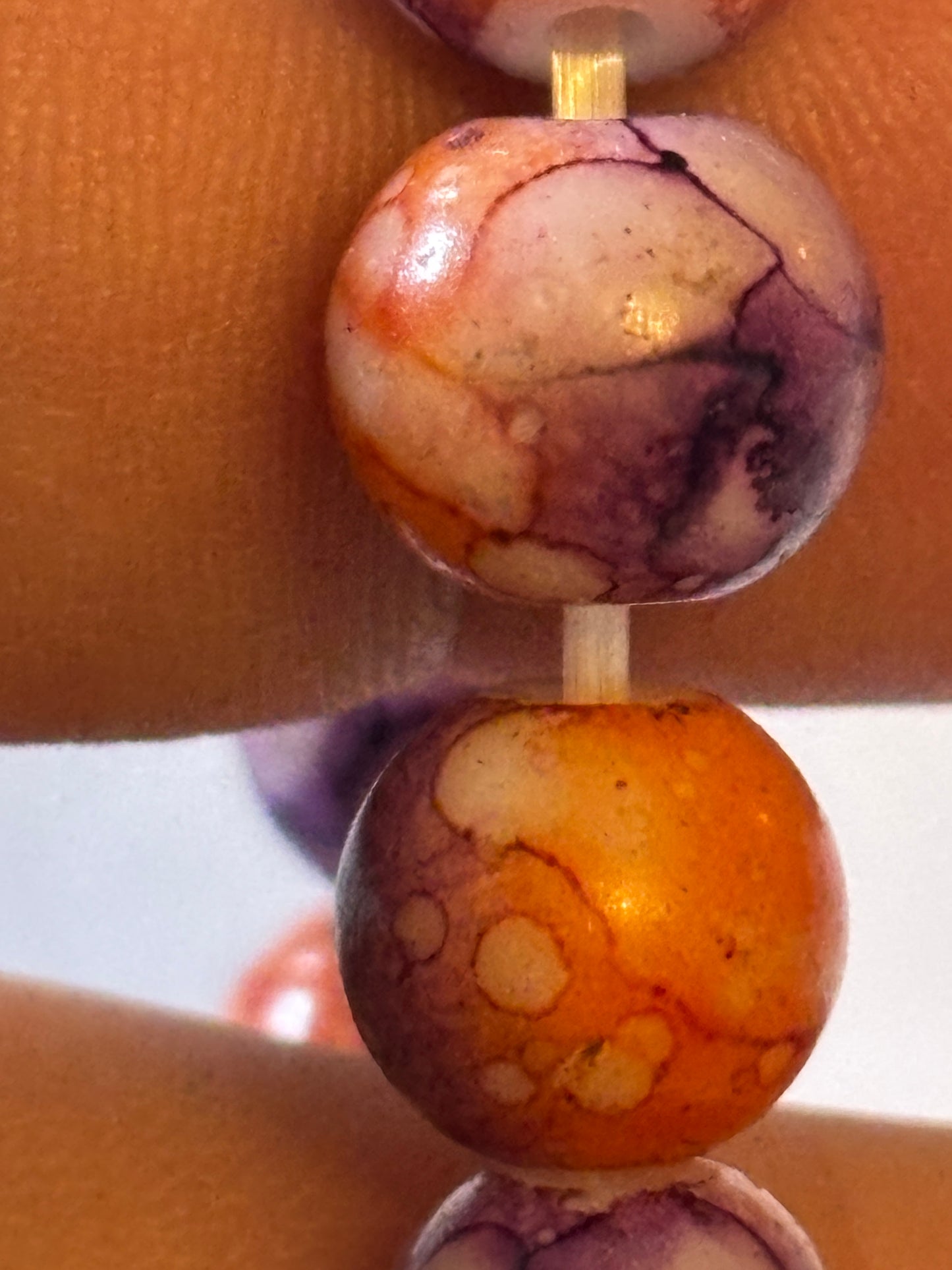 Marbled orange and purple round bead bracelet