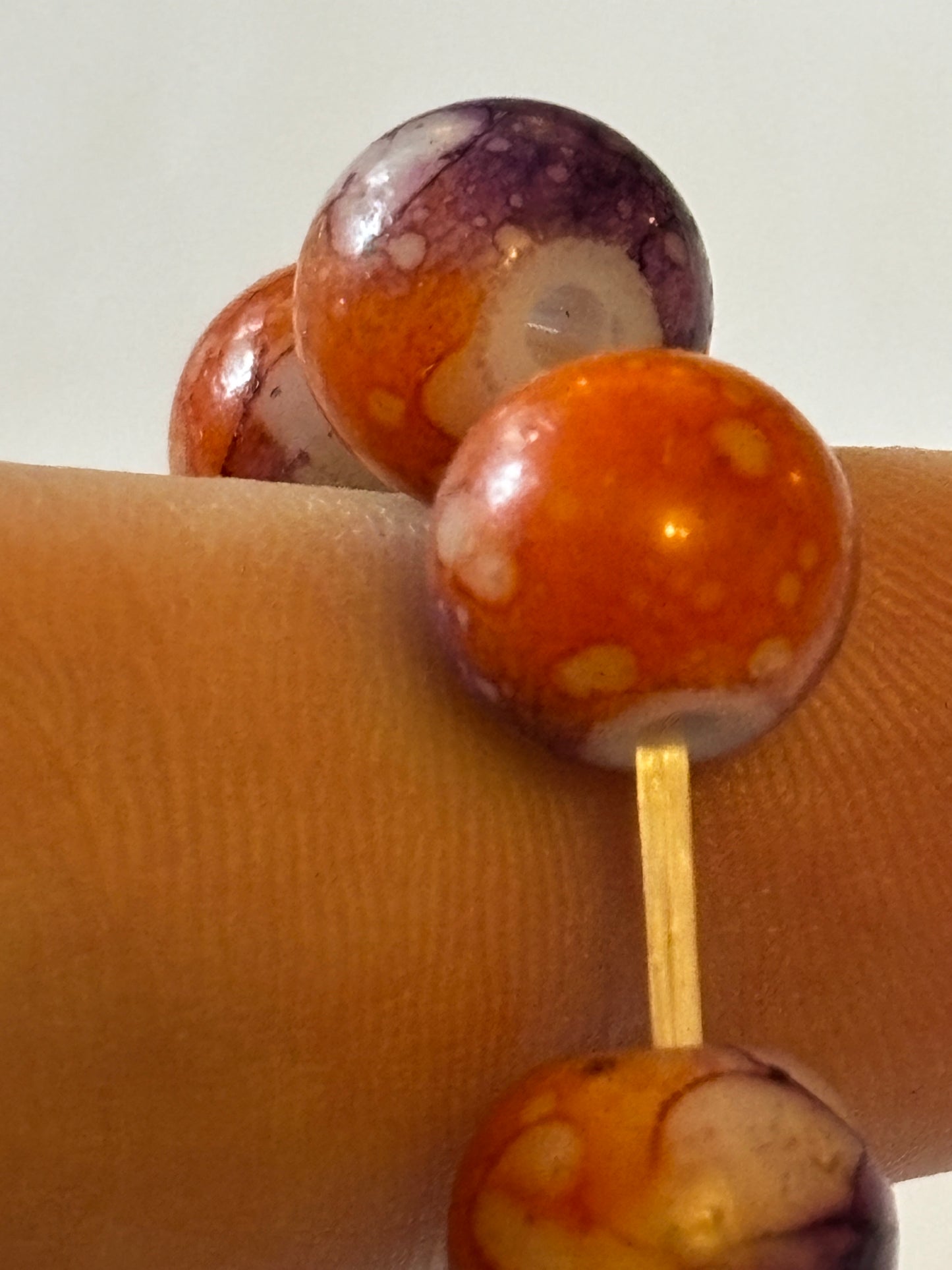 Marbled orange and purple round bead bracelet