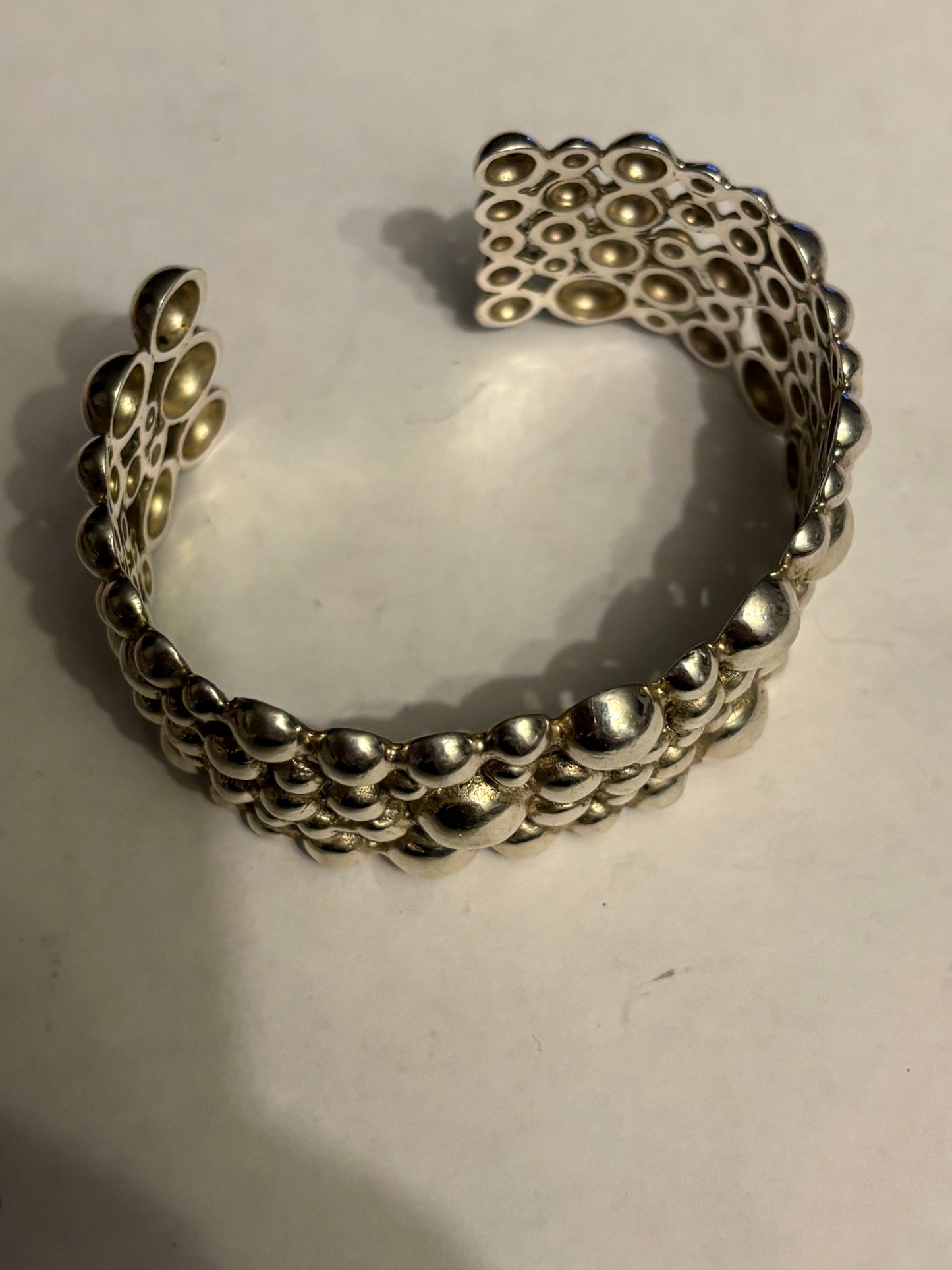 Silver multi bobble open bangle