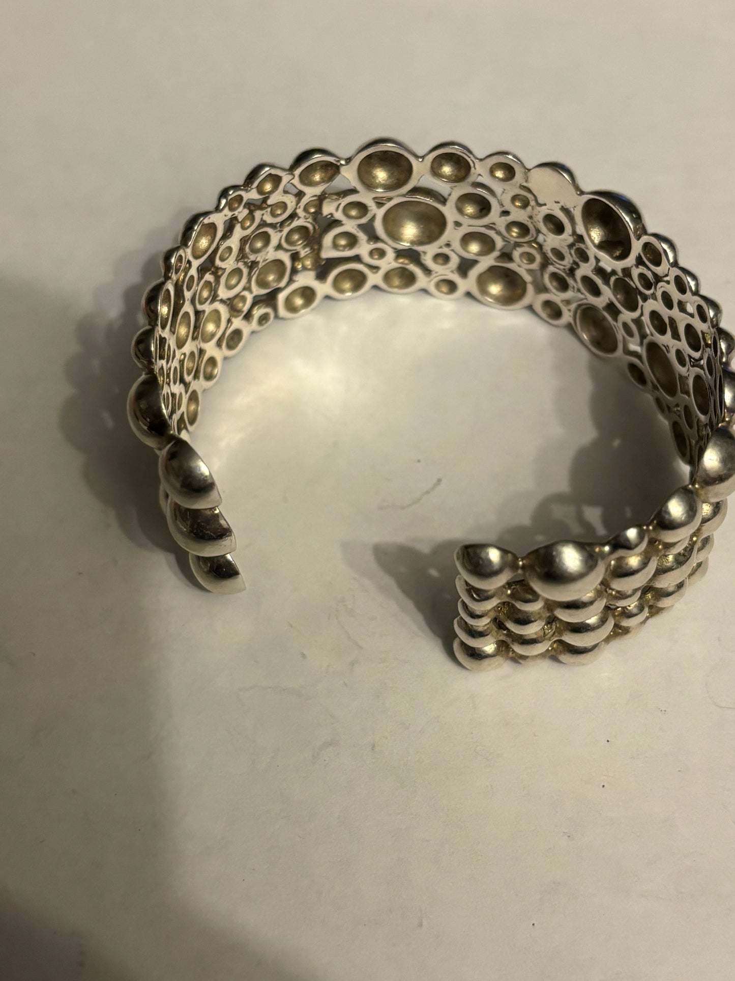 Silver multi bobble open bangle