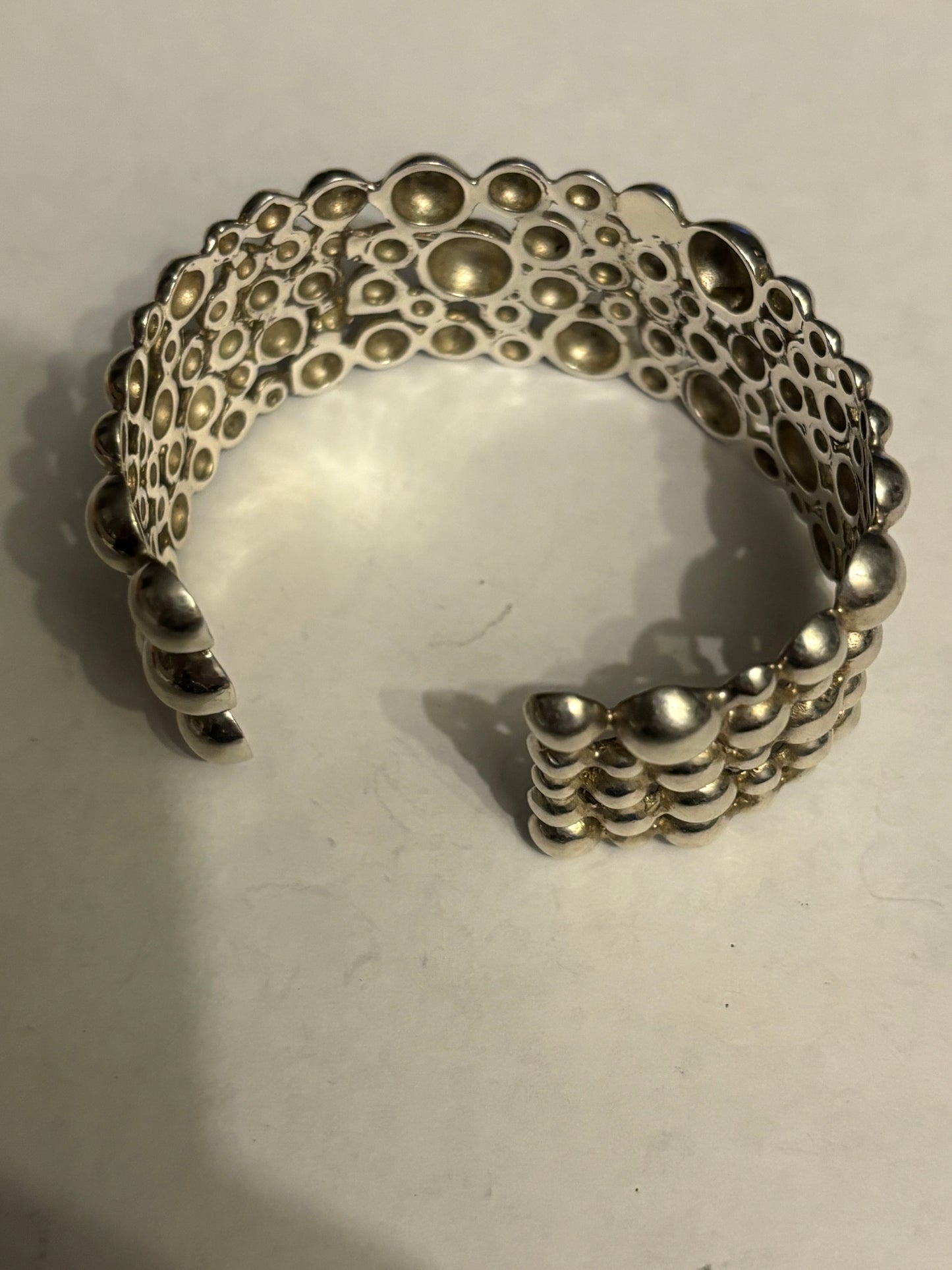 Silver multi bobble open bangle