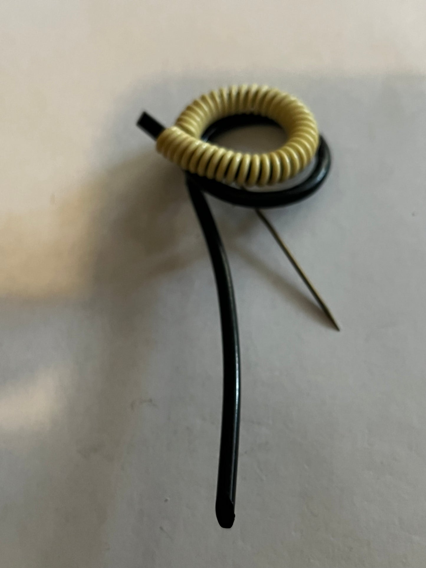 Unusual abstract black tube and white coil hatpin/brooch