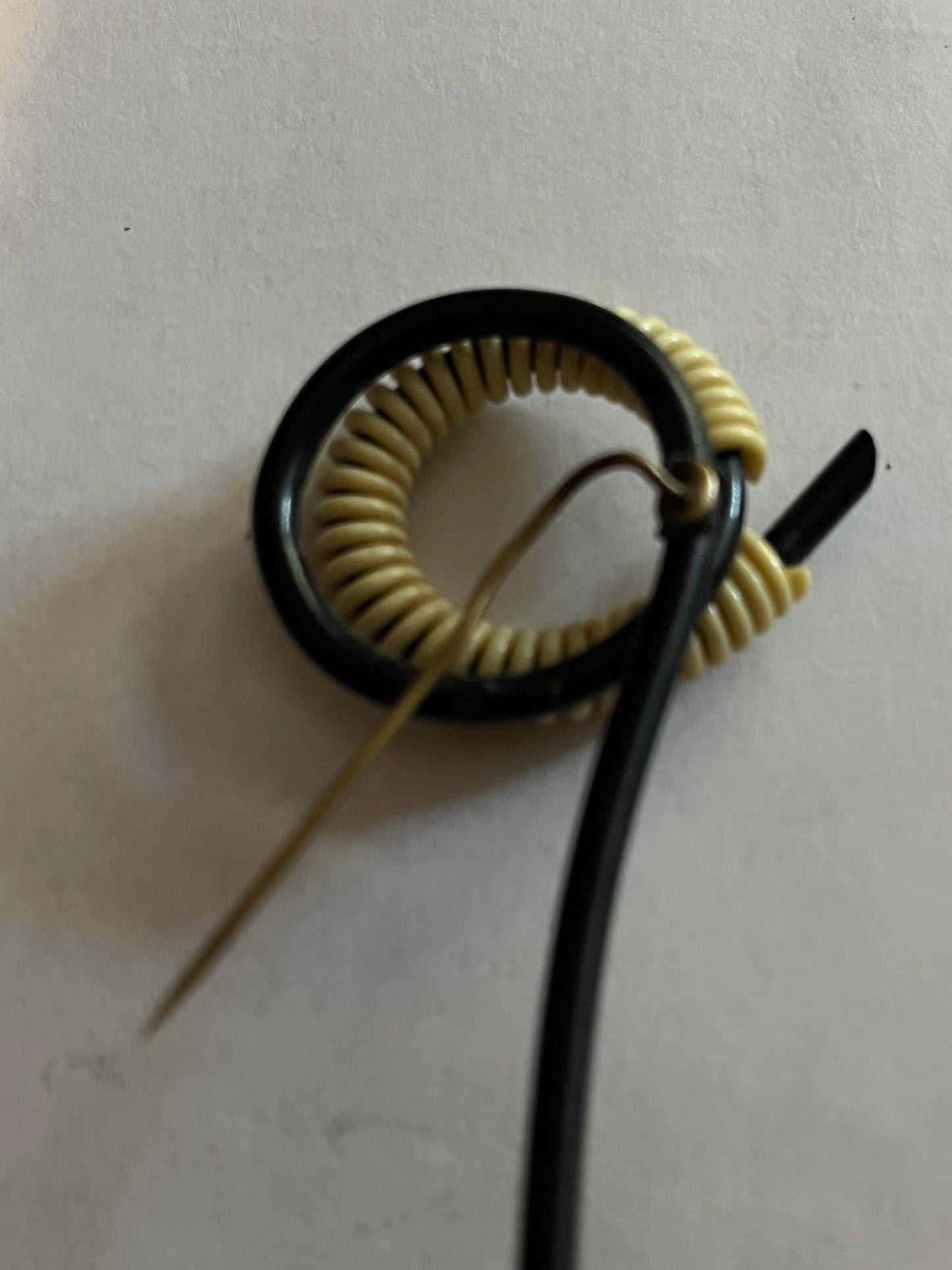 Unusual abstract black tube and white coil hatpin/brooch