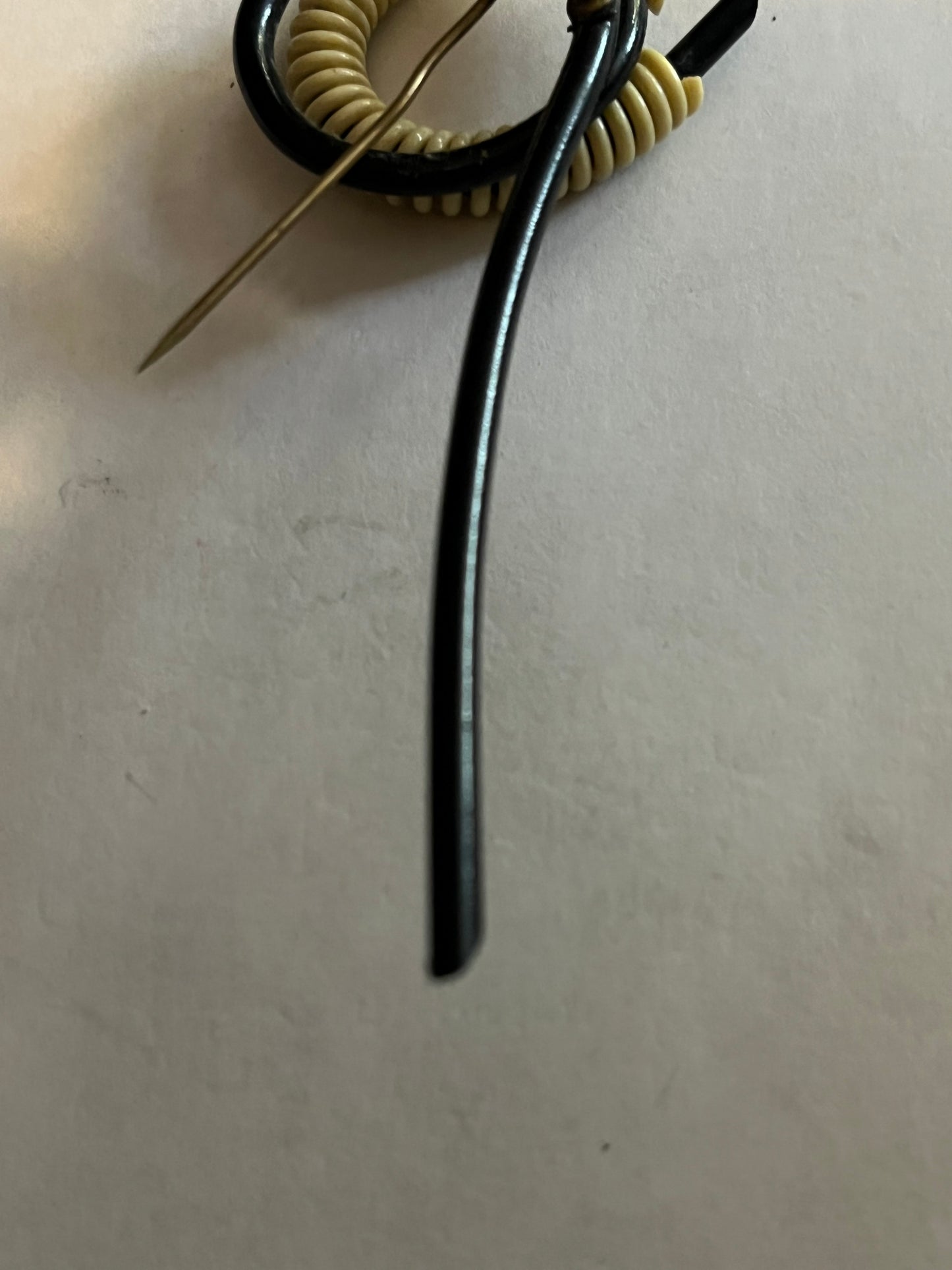 Unusual abstract black tube and white coil hatpin/brooch