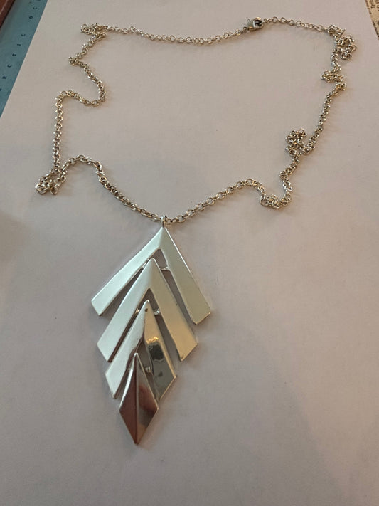 Long silver necklace with chevrons pendant