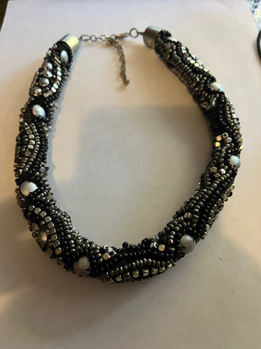 Large beaded stiff tube necklace with black and silver beads and sequins