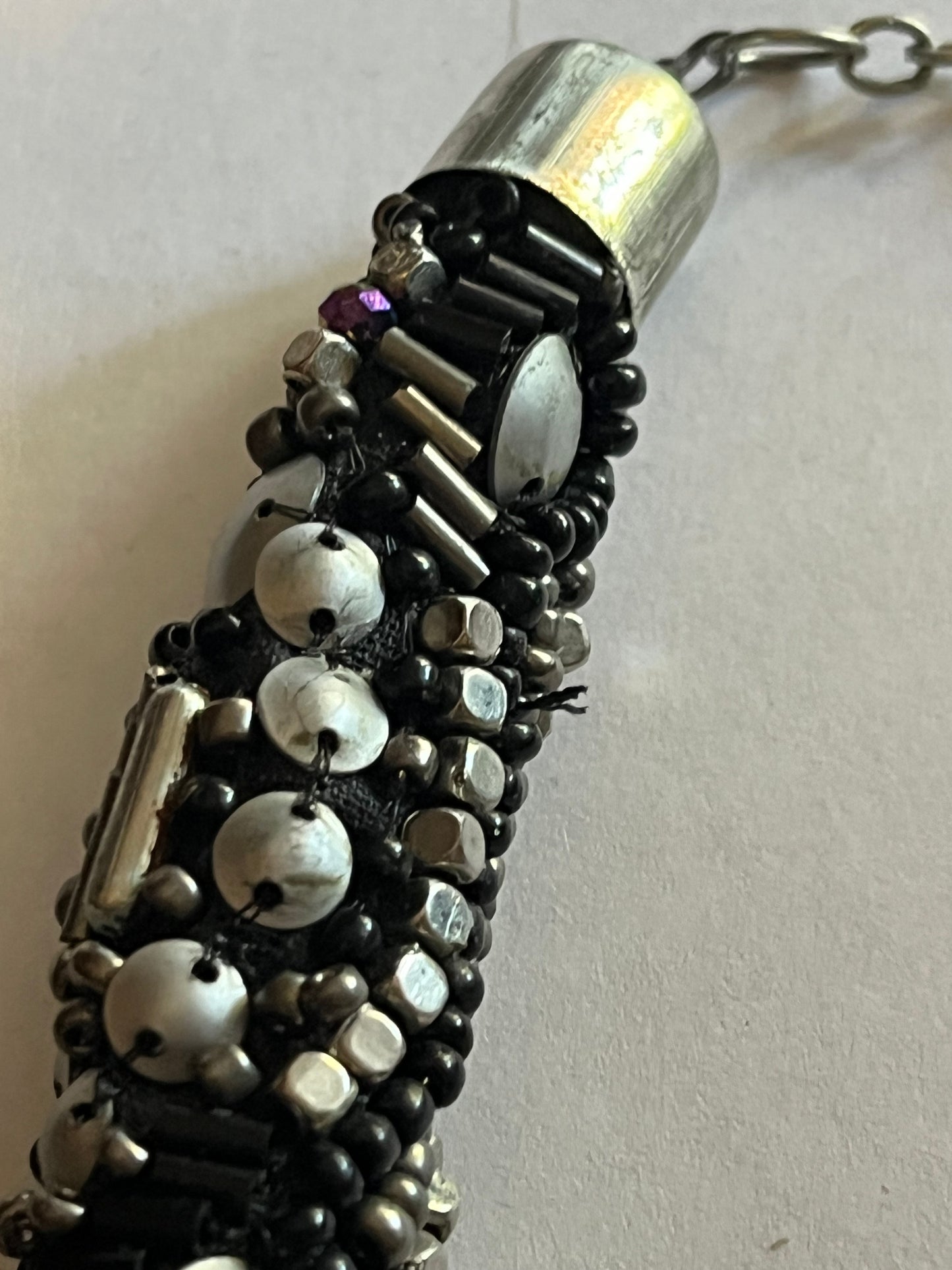 Large beaded stiff tube necklace with black and silver beads and sequins