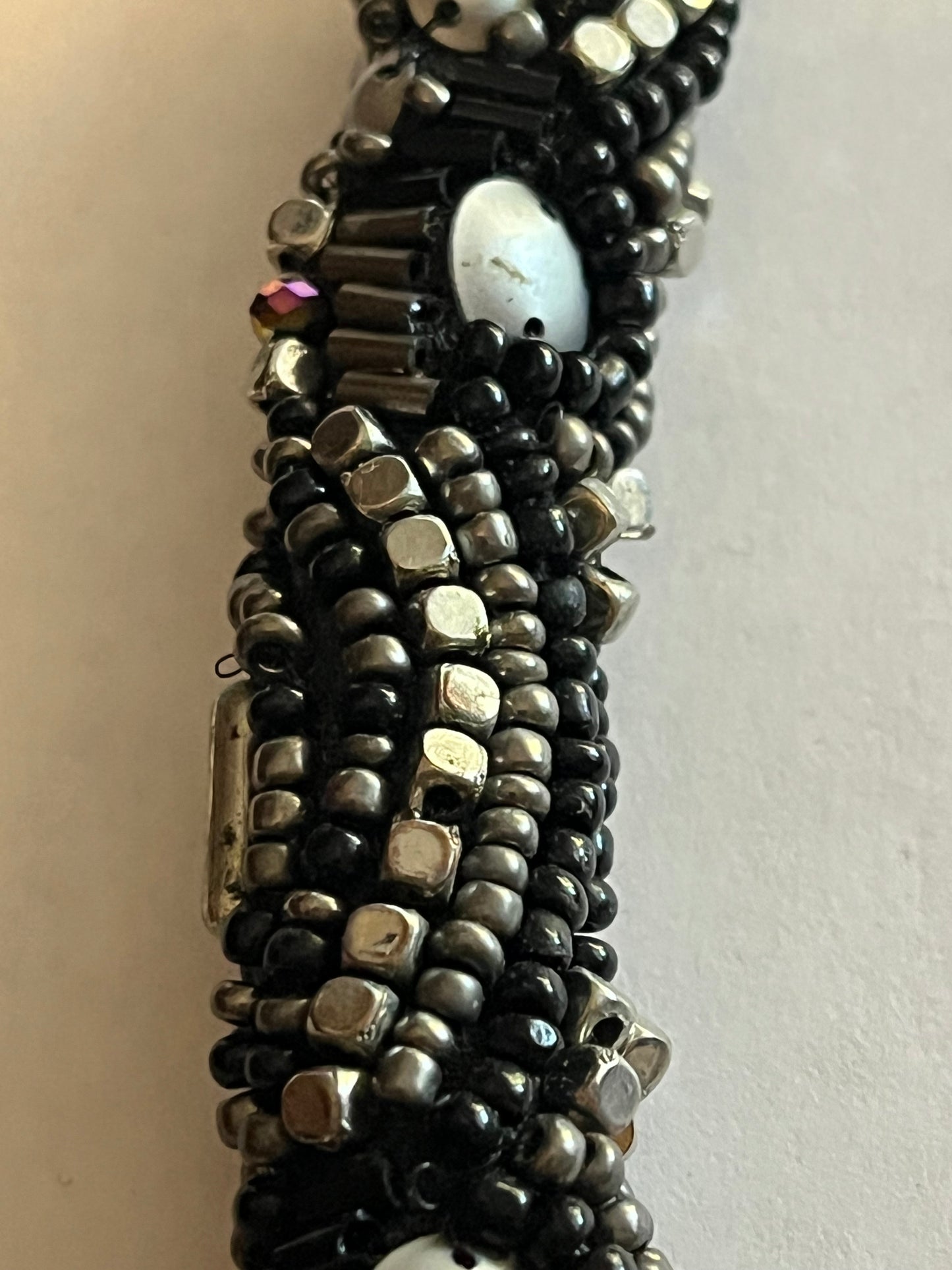 Large beaded stiff tube necklace with black and silver beads and sequins