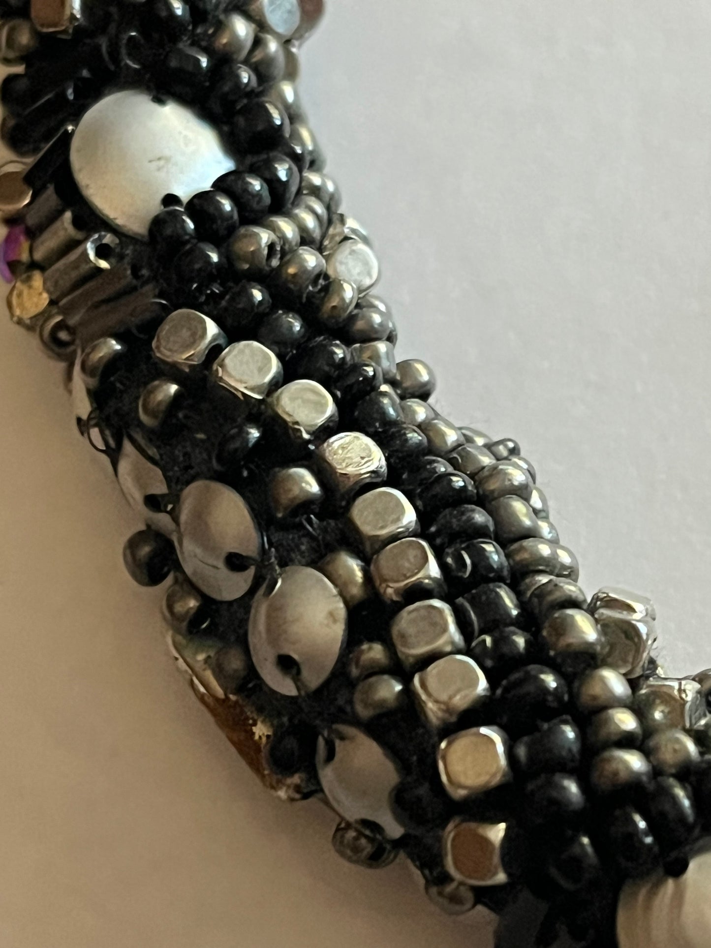 Large beaded stiff tube necklace with black and silver beads and sequins