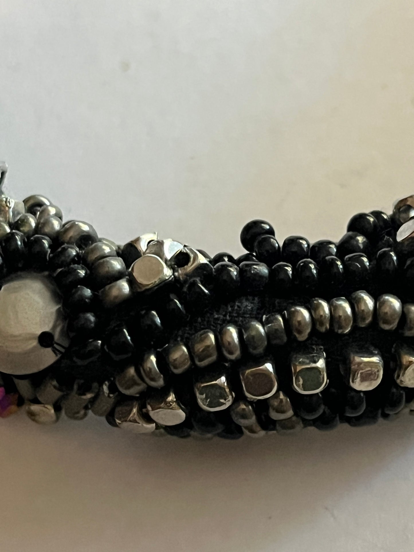 Large beaded stiff tube necklace with black and silver beads and sequins