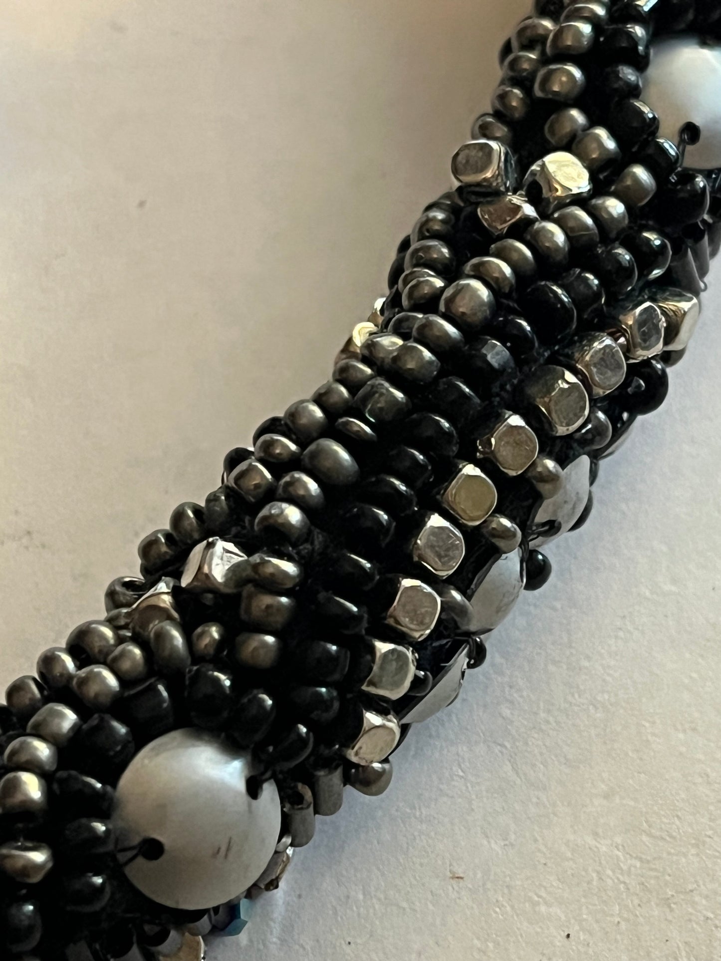 Large beaded stiff tube necklace with black and silver beads and sequins