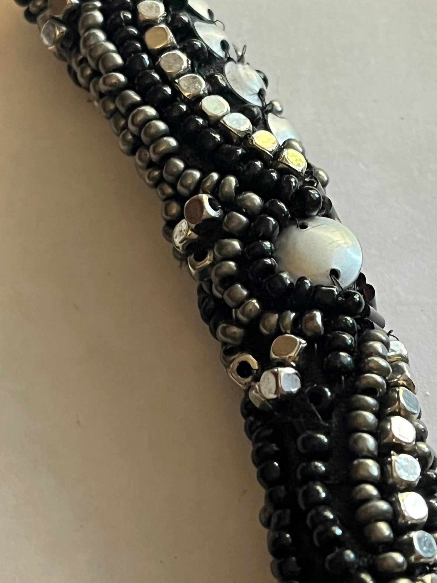 Large beaded stiff tube necklace with black and silver beads and sequins