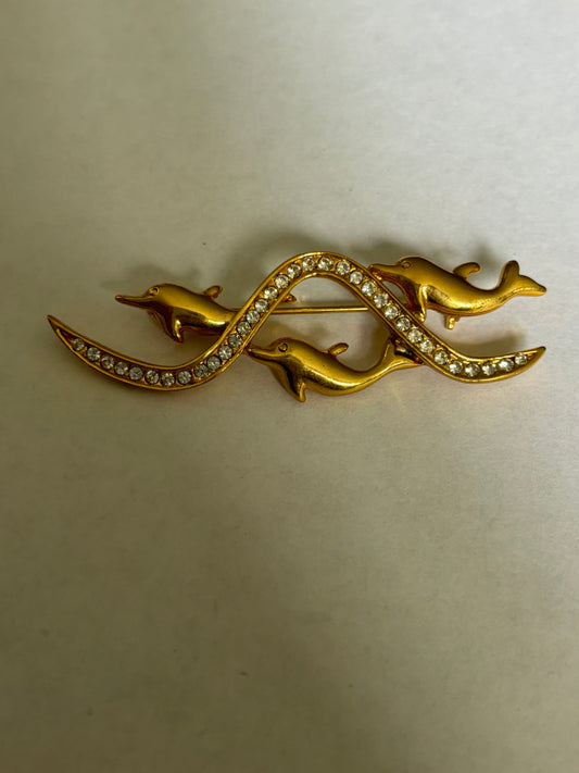 Gold metal triple dolphin and diamante brooch