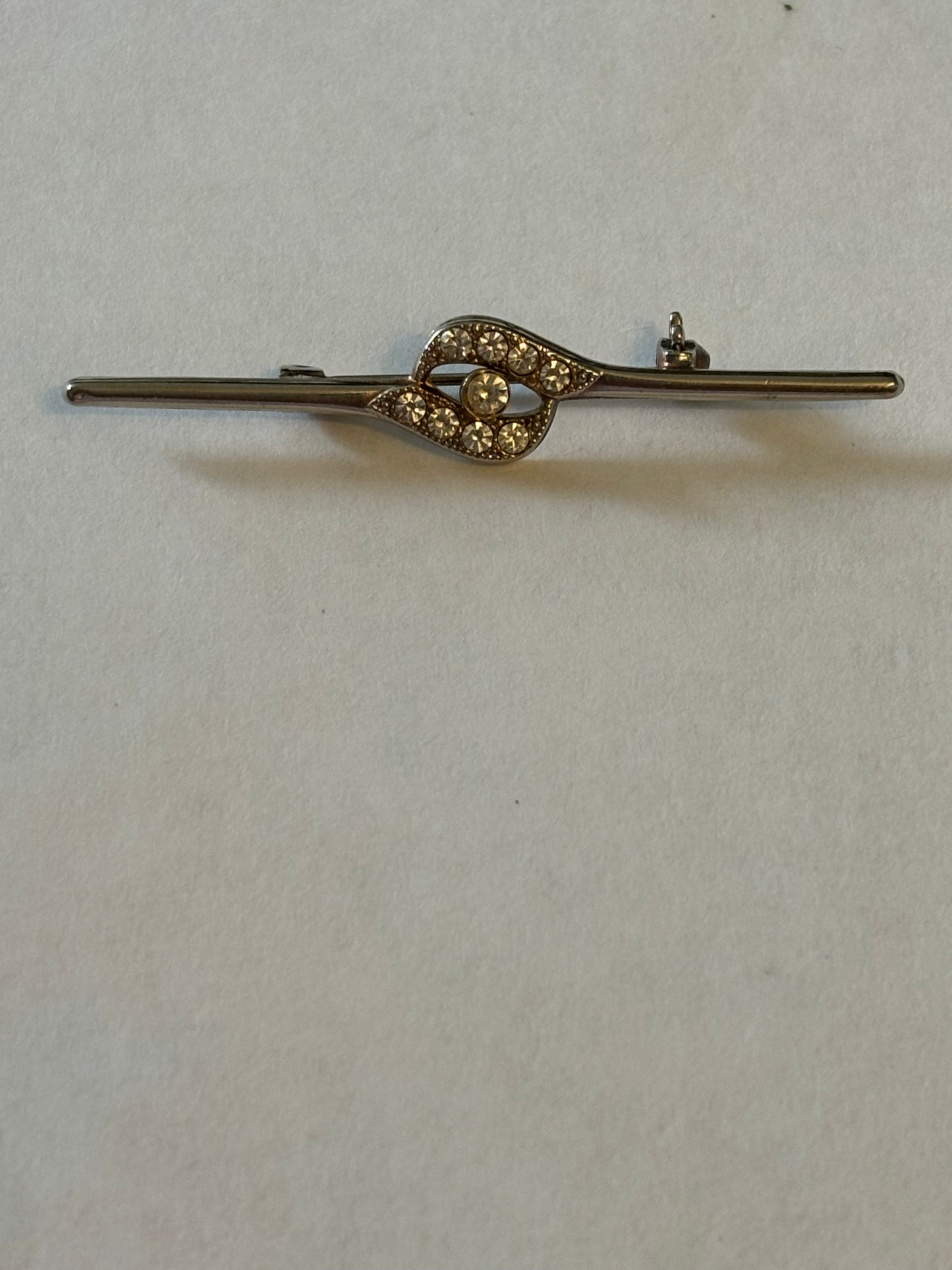 Silver metal bar brooch with diamante grouping