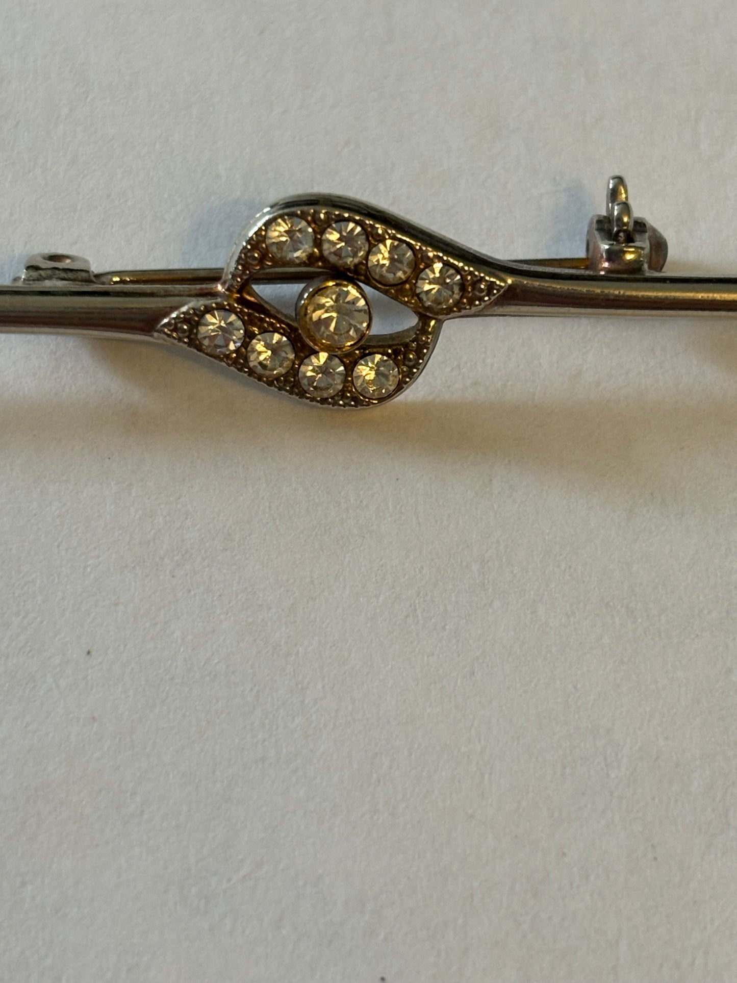 Silver metal bar brooch with diamante grouping