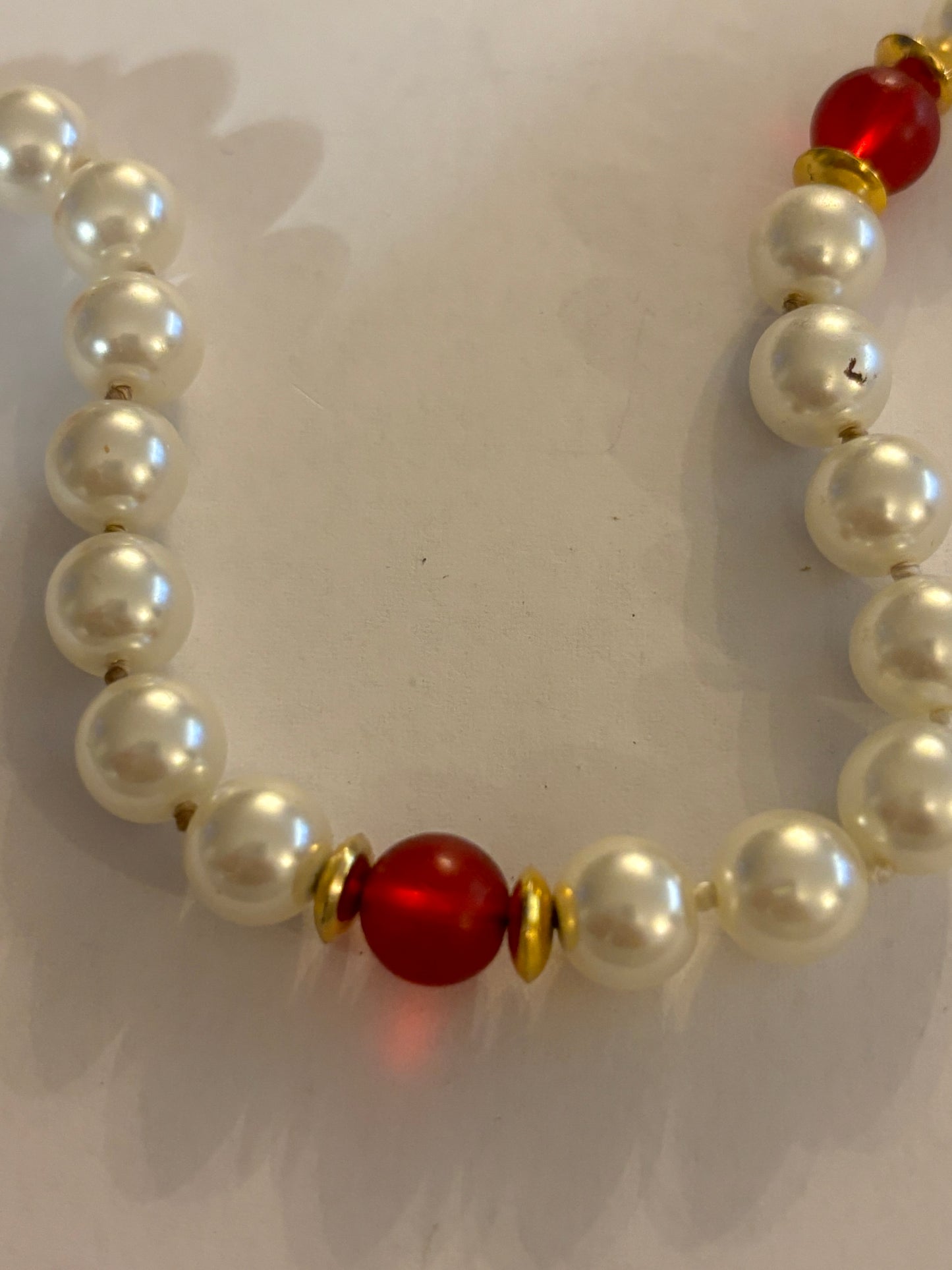 Large pearl style necklace with red bead spacers