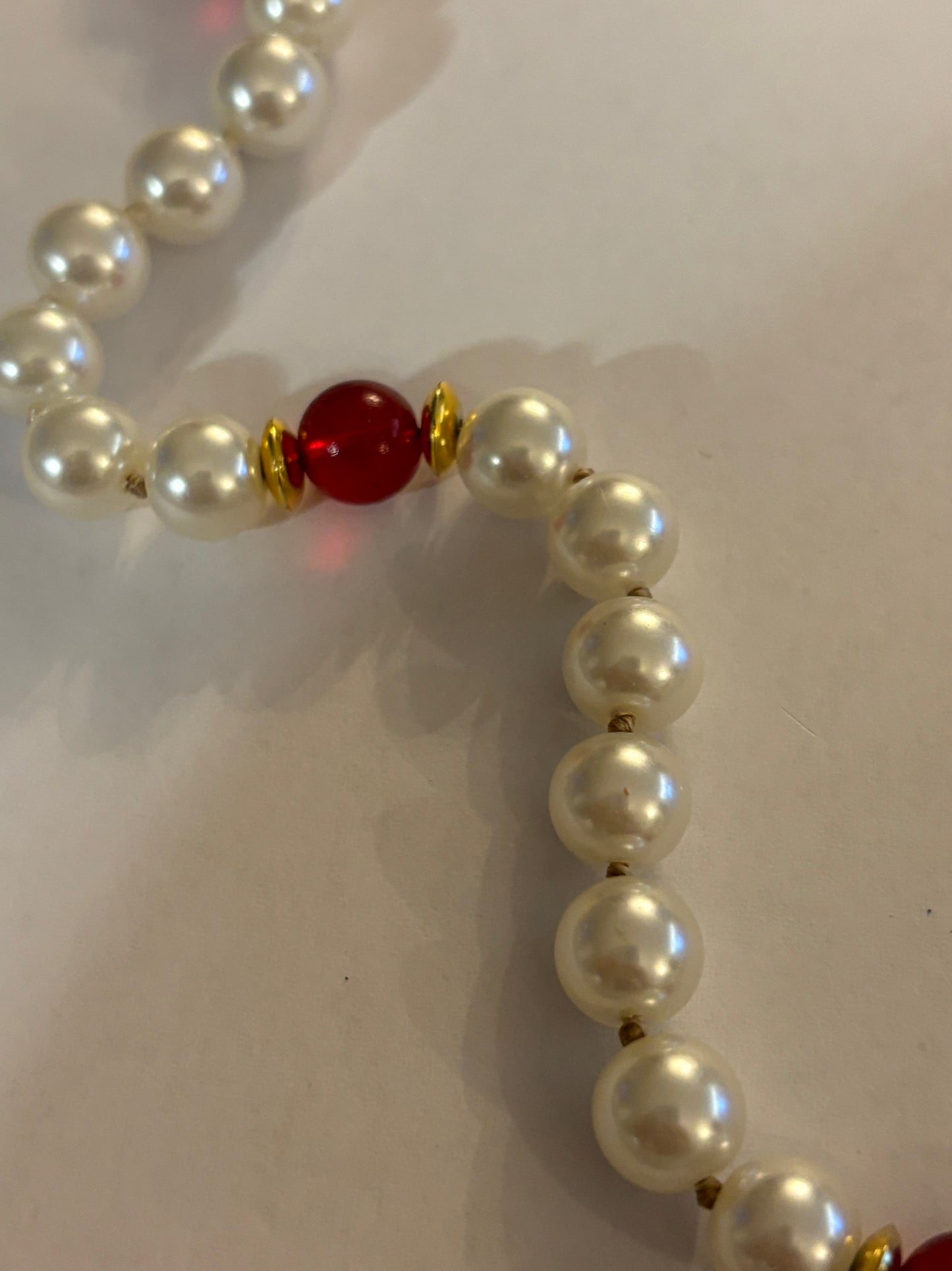 Large pearl style necklace with red bead spacers