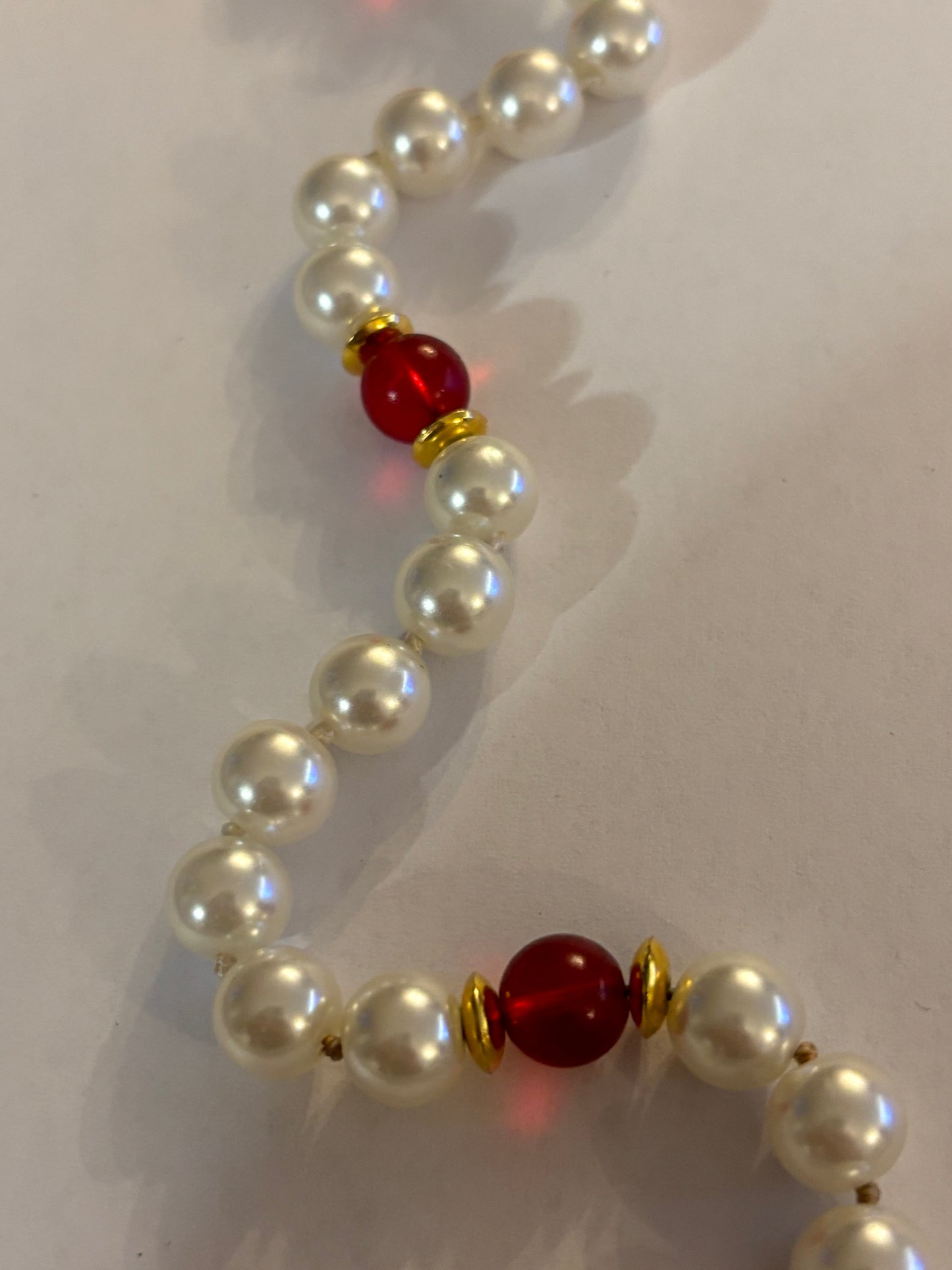 Large pearl style necklace with red bead spacers