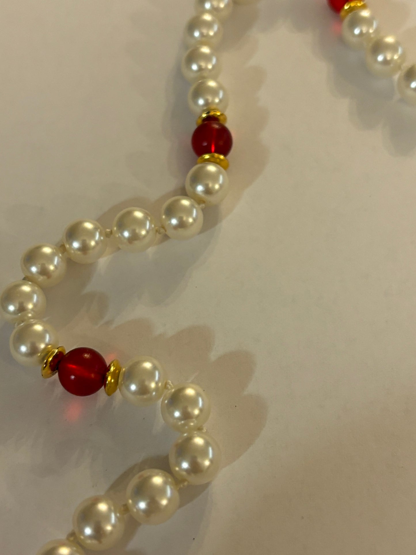 Large pearl style necklace with red bead spacers