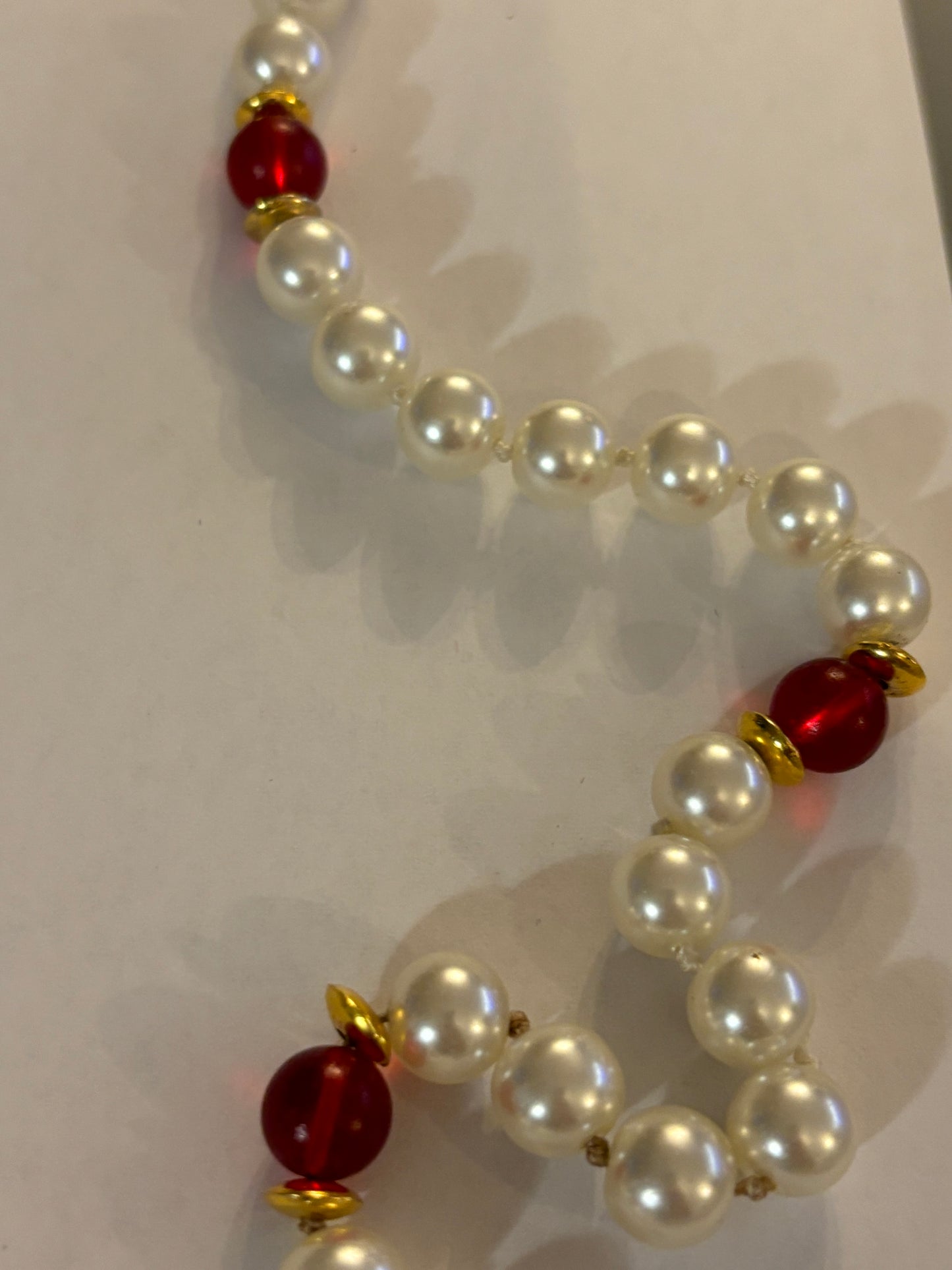 Large pearl style necklace with red bead spacers