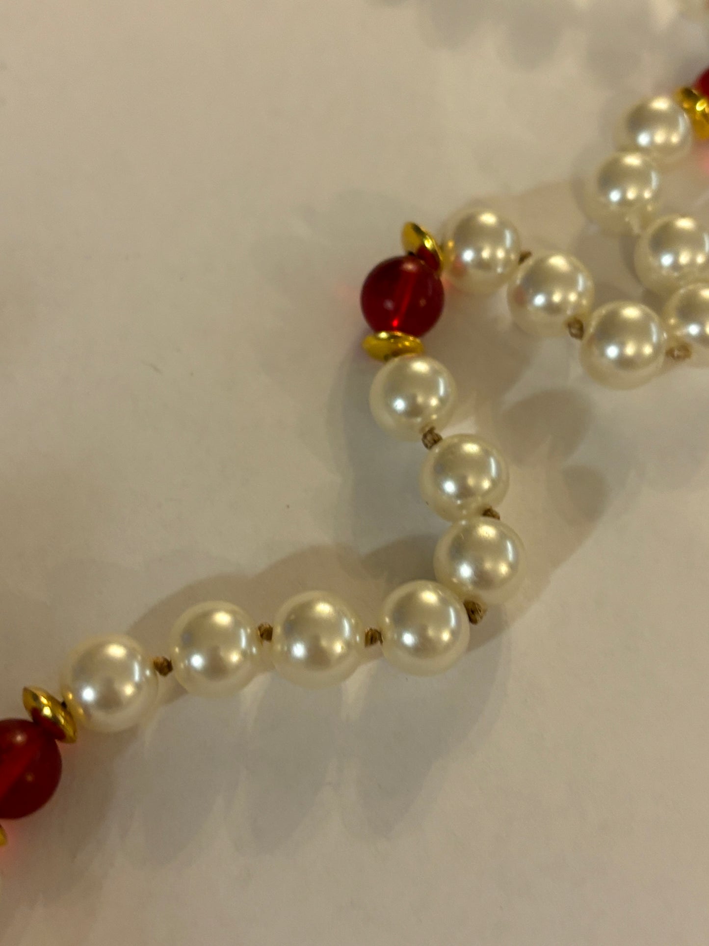 Large pearl style necklace with red bead spacers