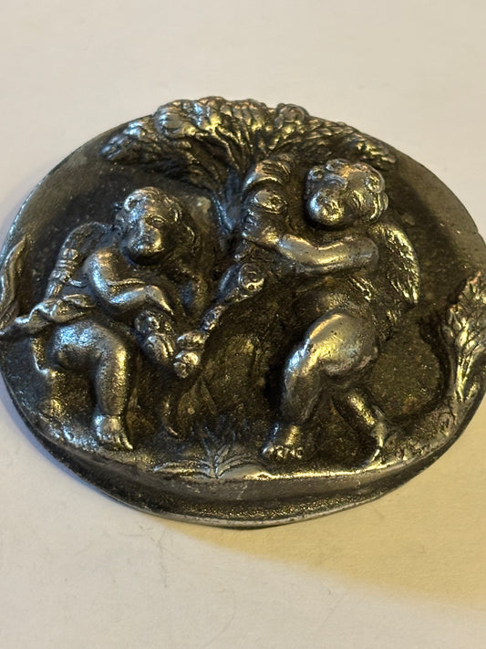 Unusual dark silver large cherub brooch