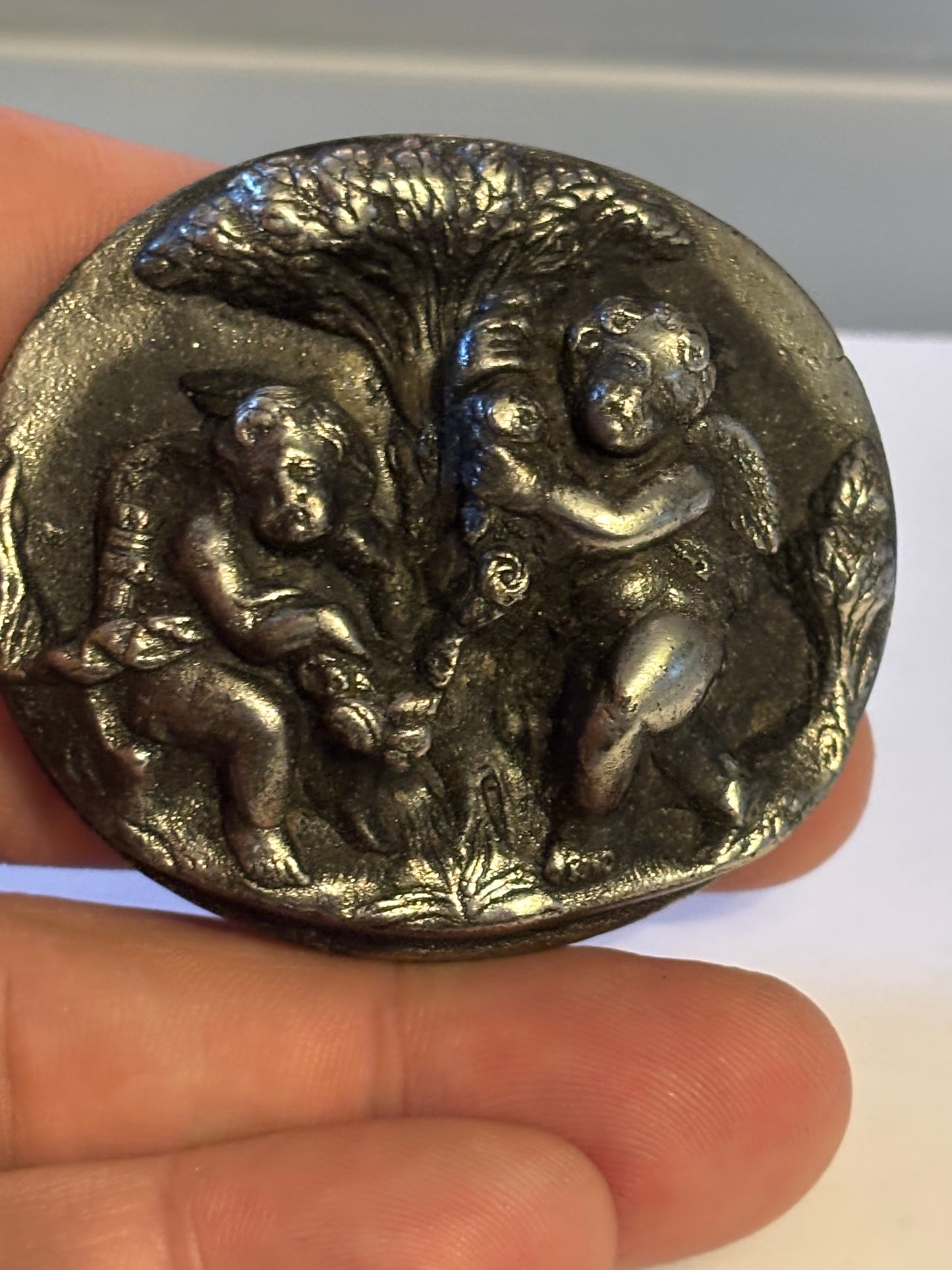 Unusual dark silver large cherub brooch