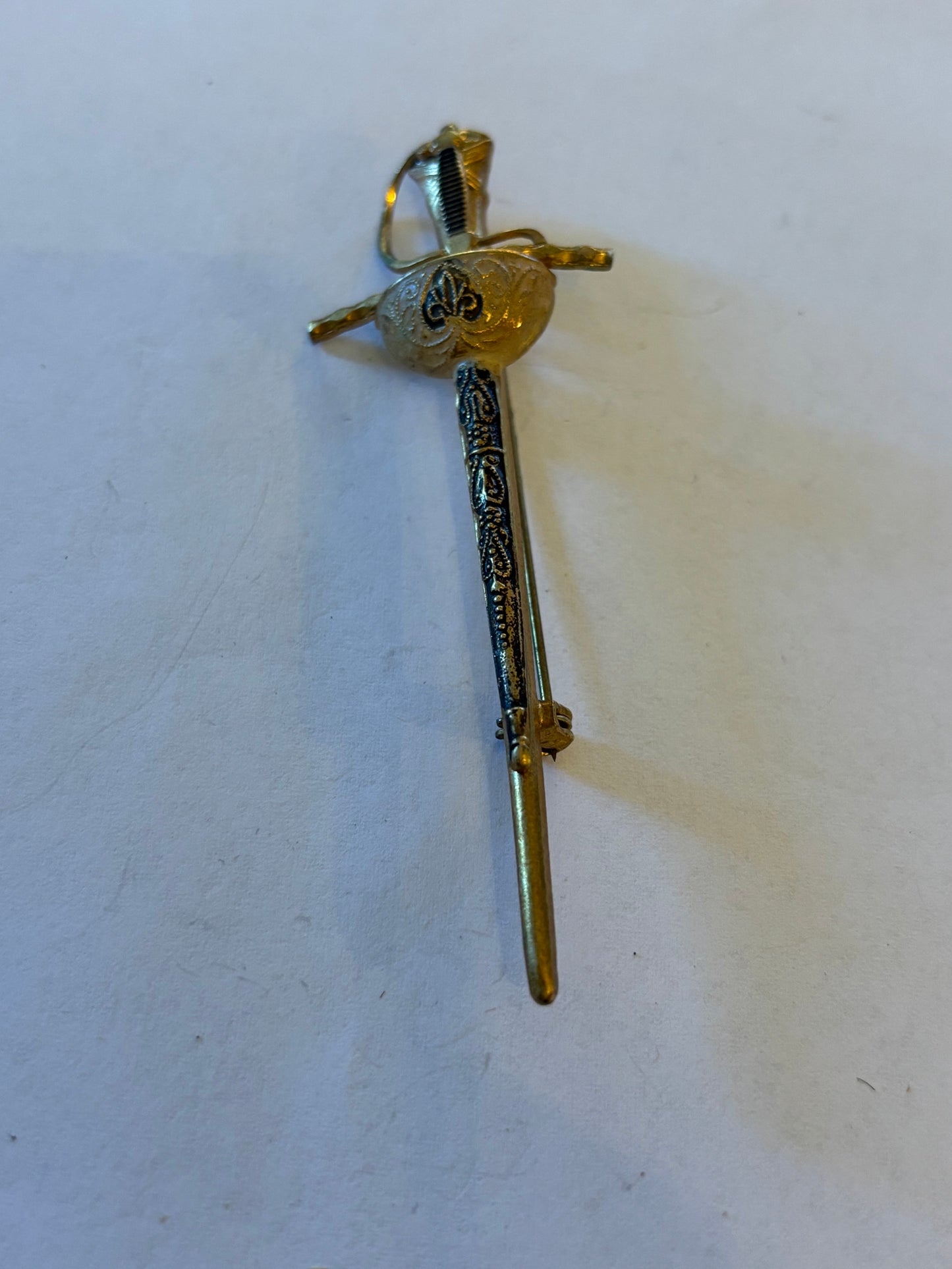 Vintage gold metal sword brooch